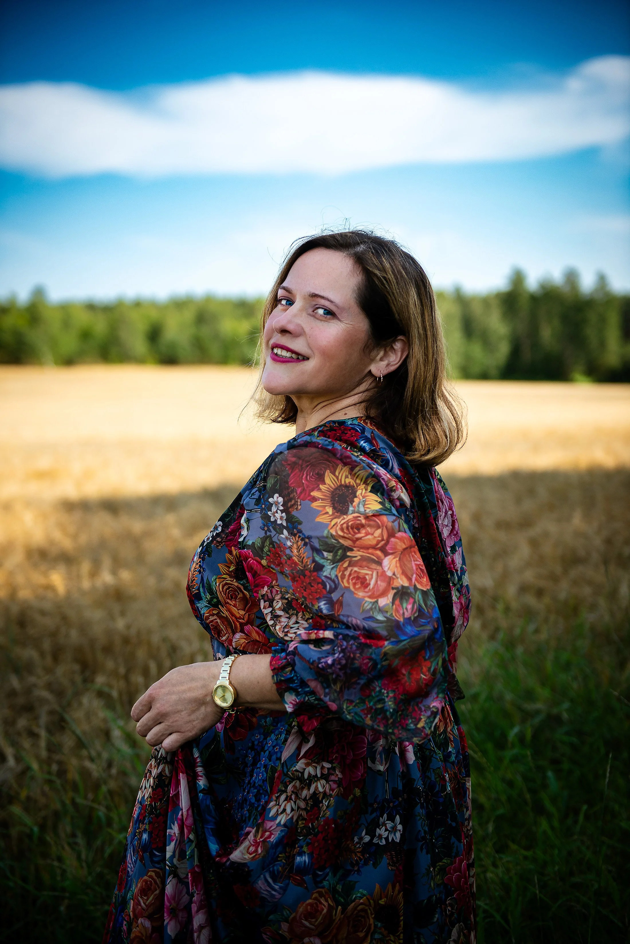 brunette-field-wearing-colorful-dress- summer-golden-hour.jpg.jpg