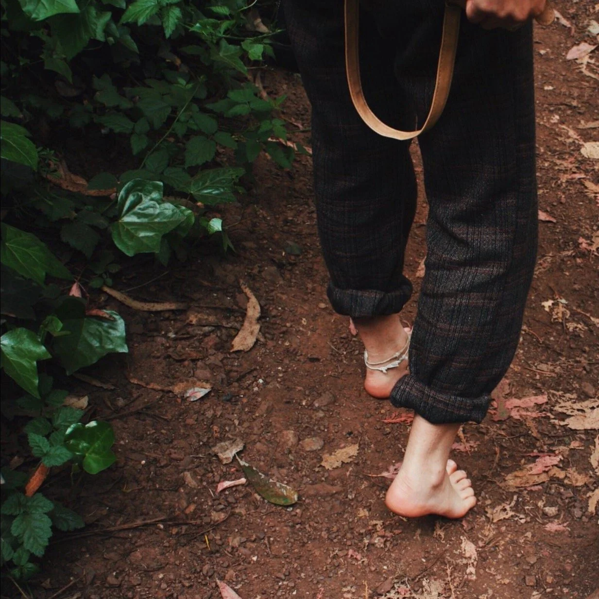 walking barefoot in a forest