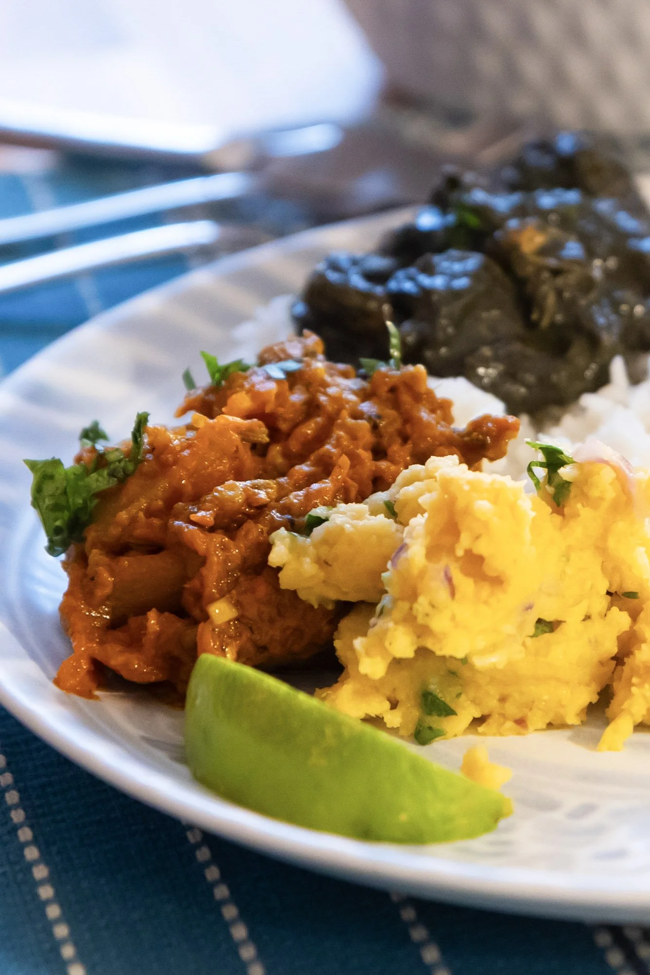 Colorful spread of Assamese vegetarian dishes with pumpkin curry, lentils, and chicken. Khokuwa supper club - North East Indian food in Philadelphia