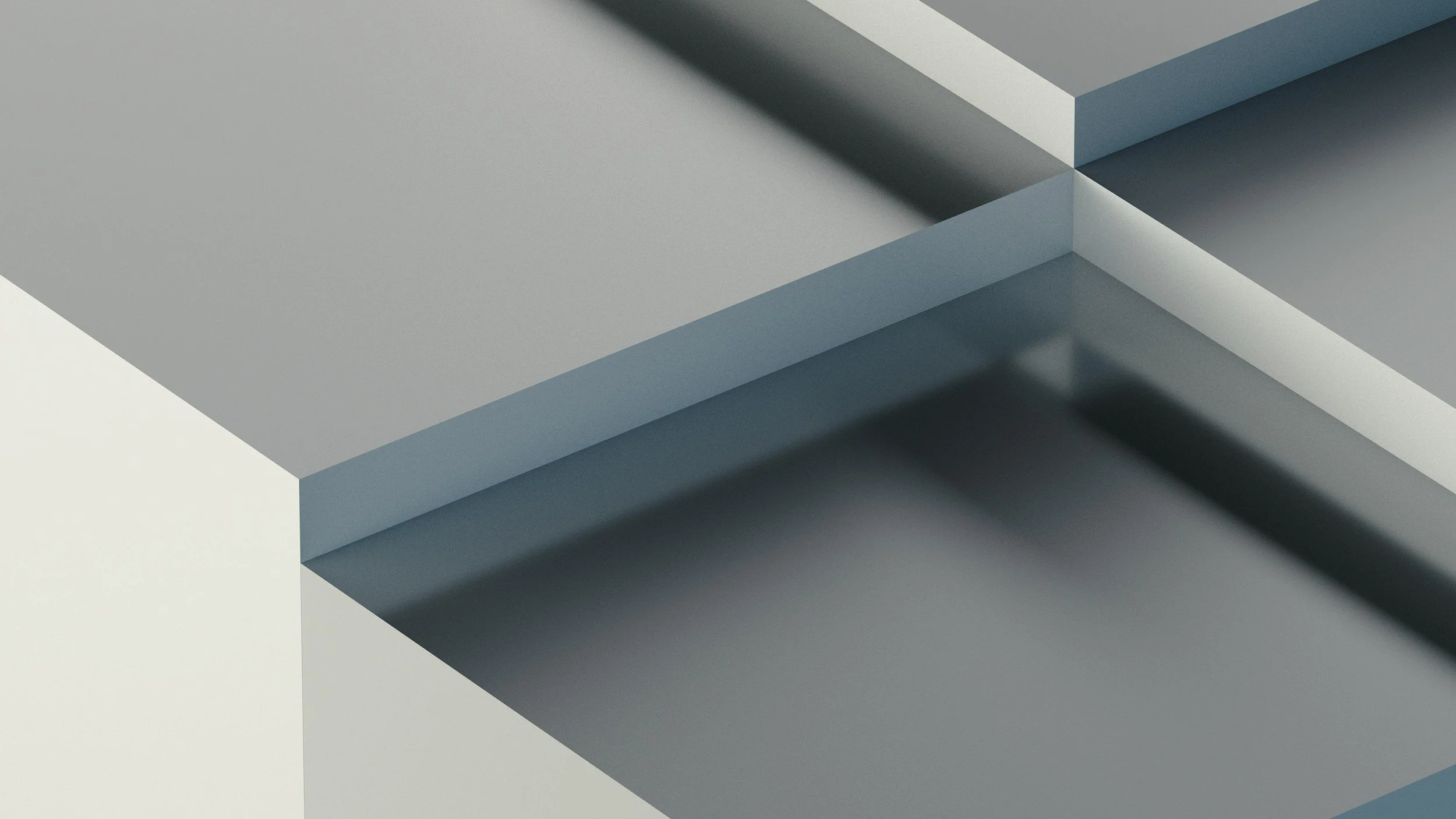 Close-up of intersecting gray and white geometric shapes with shadows