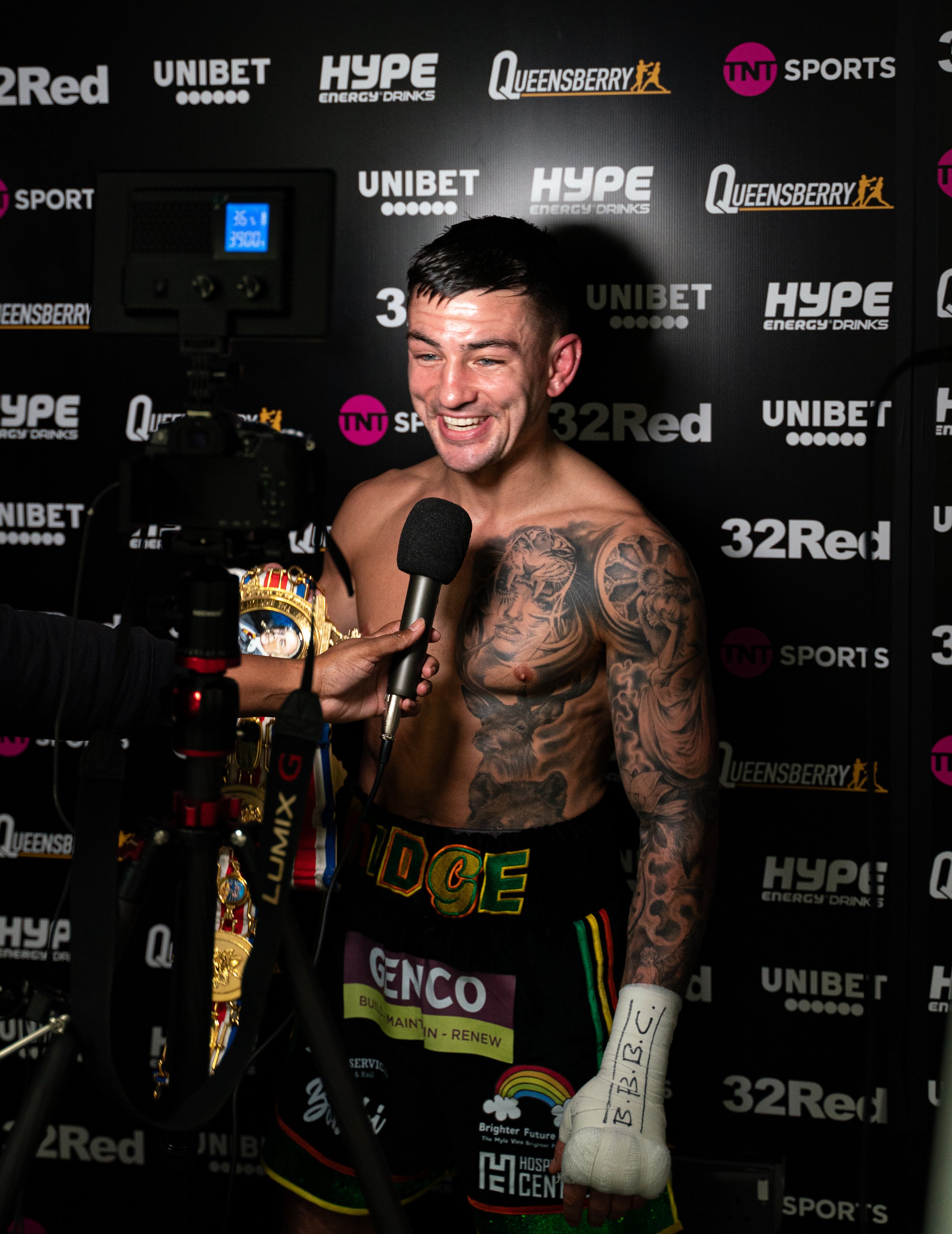 Sam Noakes celebrates his British Title win backstage at the Copperbox Arena London