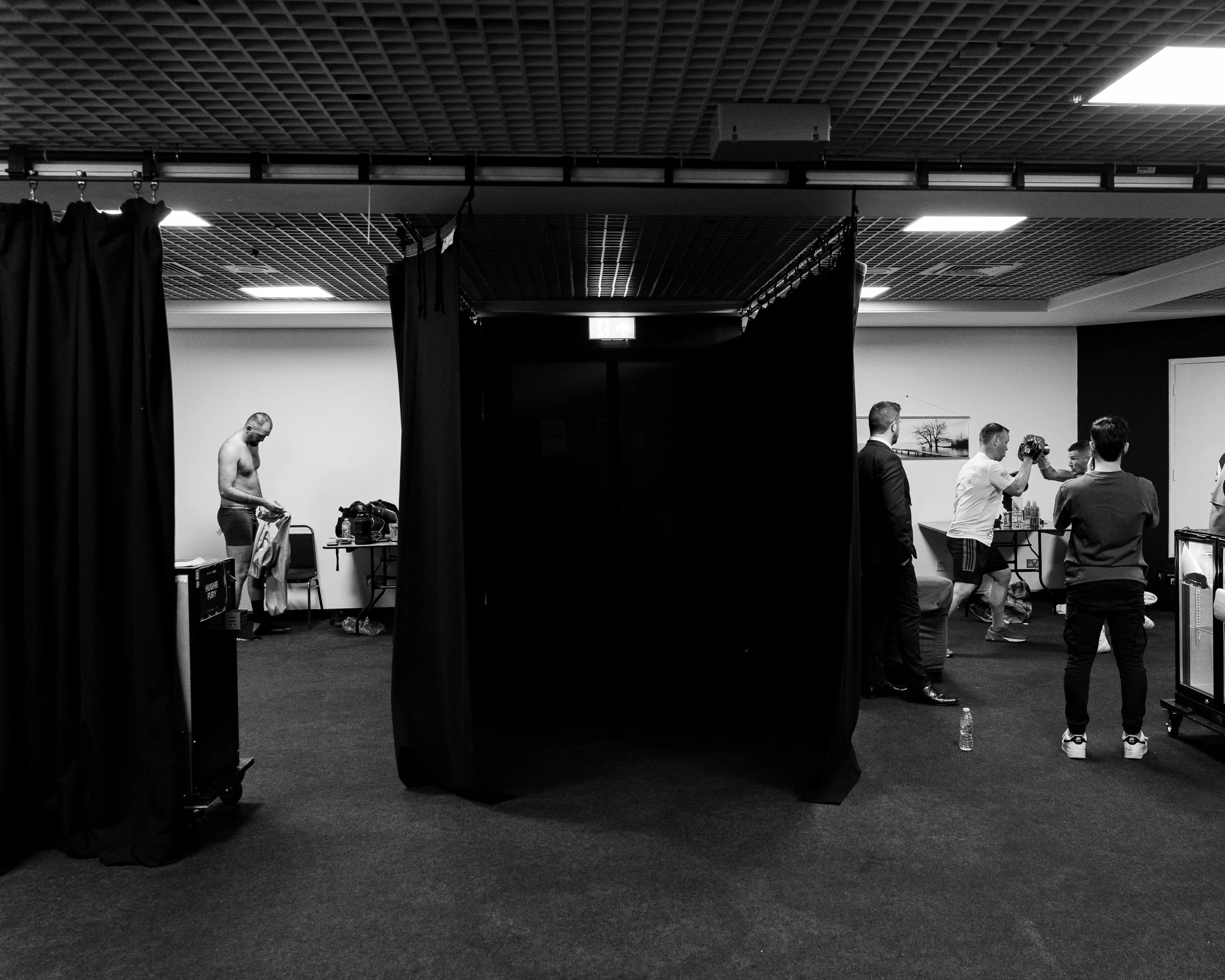 Hughie Fury getting dressed whilst Rhys Edwards warms up to go out in Cardiff