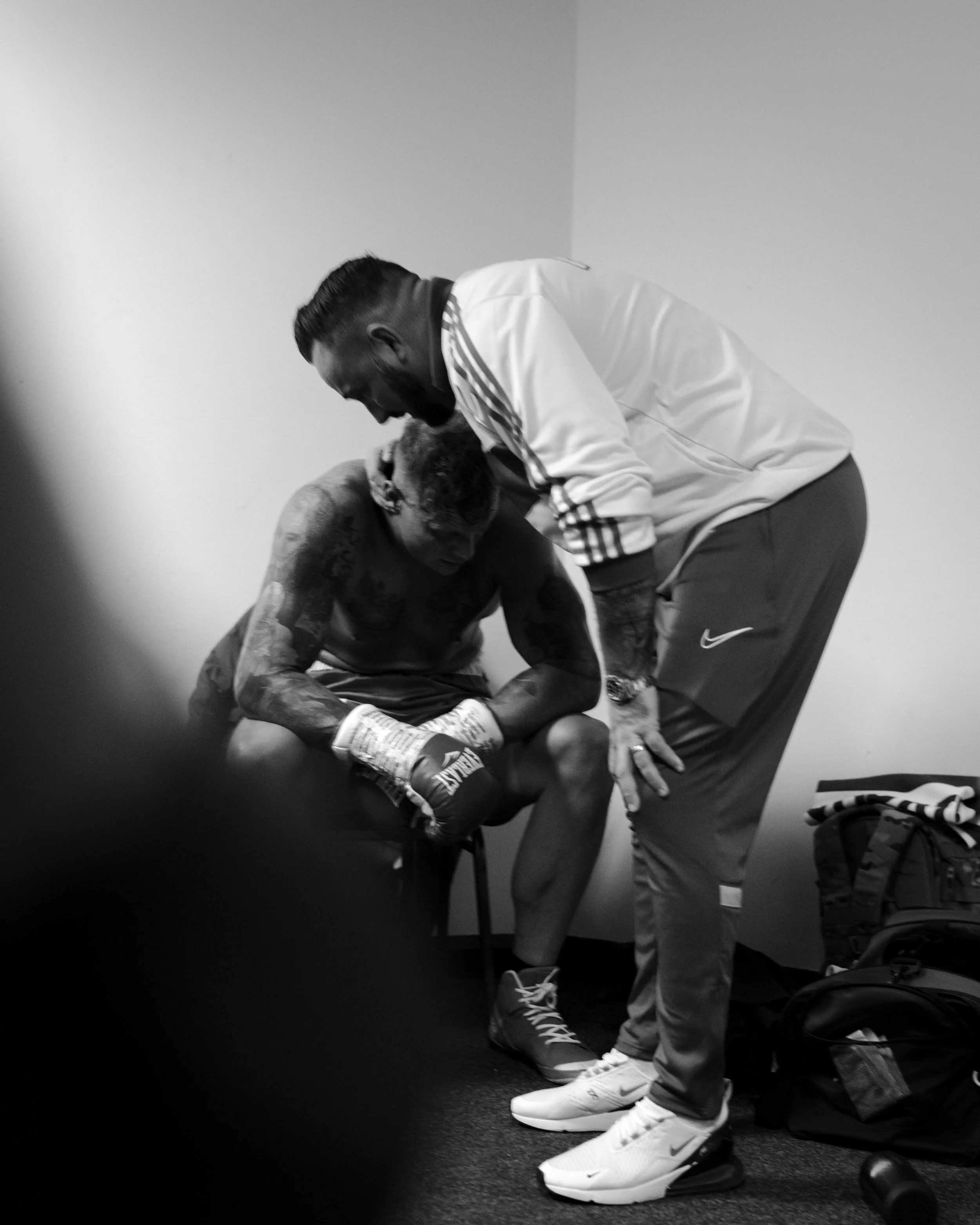 Steve Robinson is consoled by his trainer after his loss in Cardiff