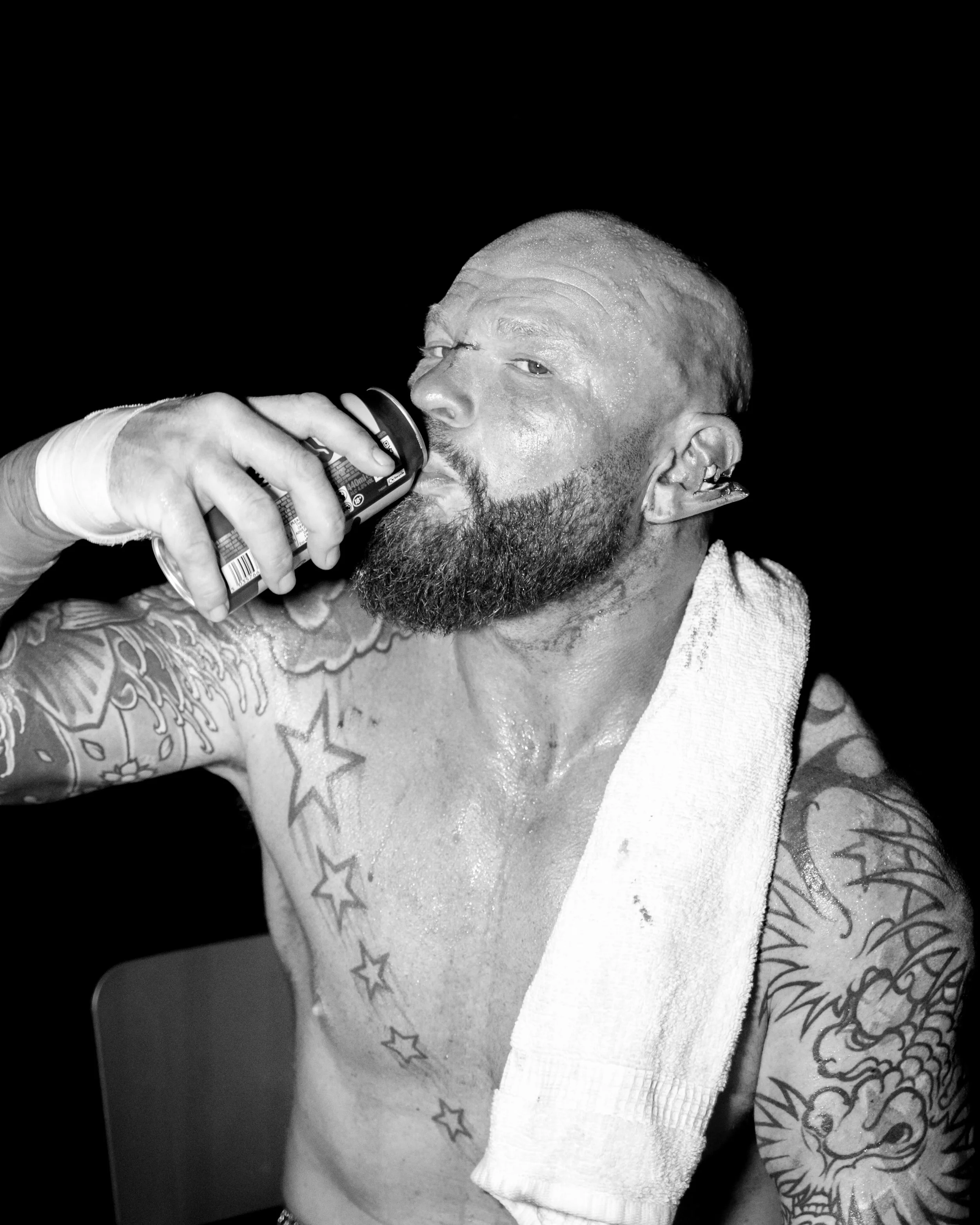 Dorian Darch proudly drinking his cider with his ear in pieces backstage at BKB Cardiff