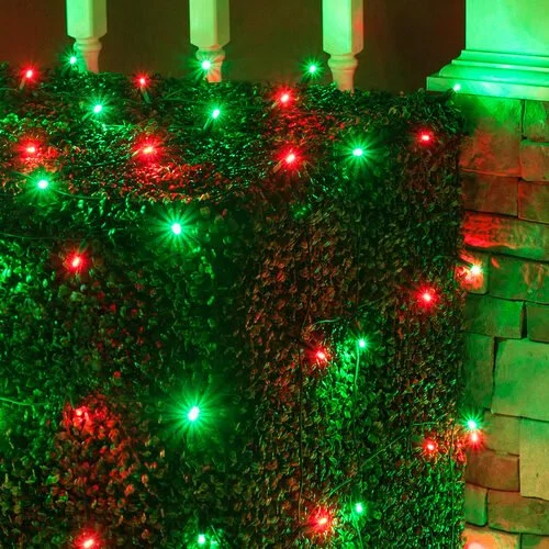 Close-up of the red and green bush net Christmas lights option available for exterior christmas light decoration from Neon Noel LLC in Paris, Texas