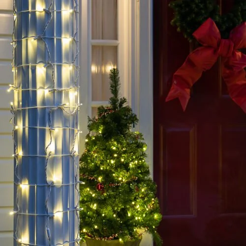 Close-up of the warm white column wrap Christmas lights option available for exterior christmas light decoration from Neon Noel LLC in Paris, Texas