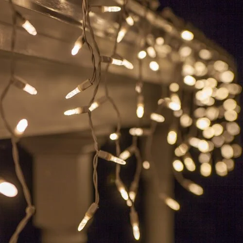 Close-up of the warm white icicle Christmas lights option available for exterior christmas light decoration from Neon Noel LLC in Northeast Texas