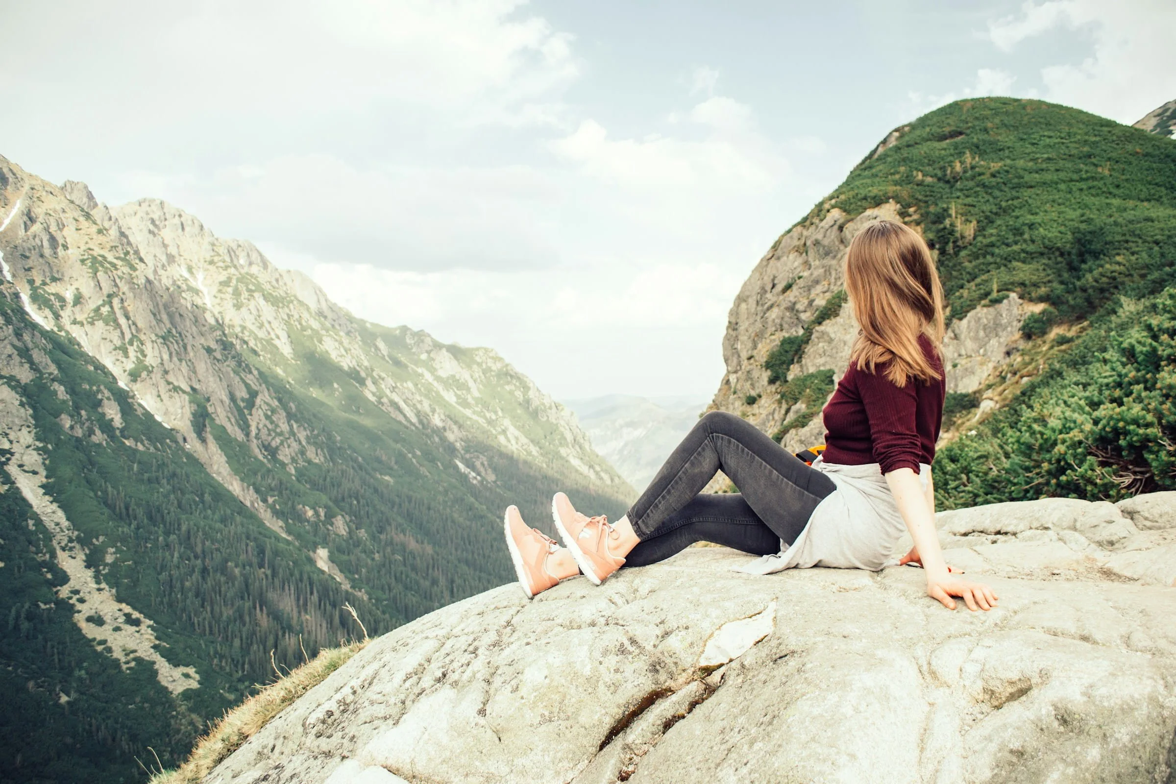 woman sitting mountains