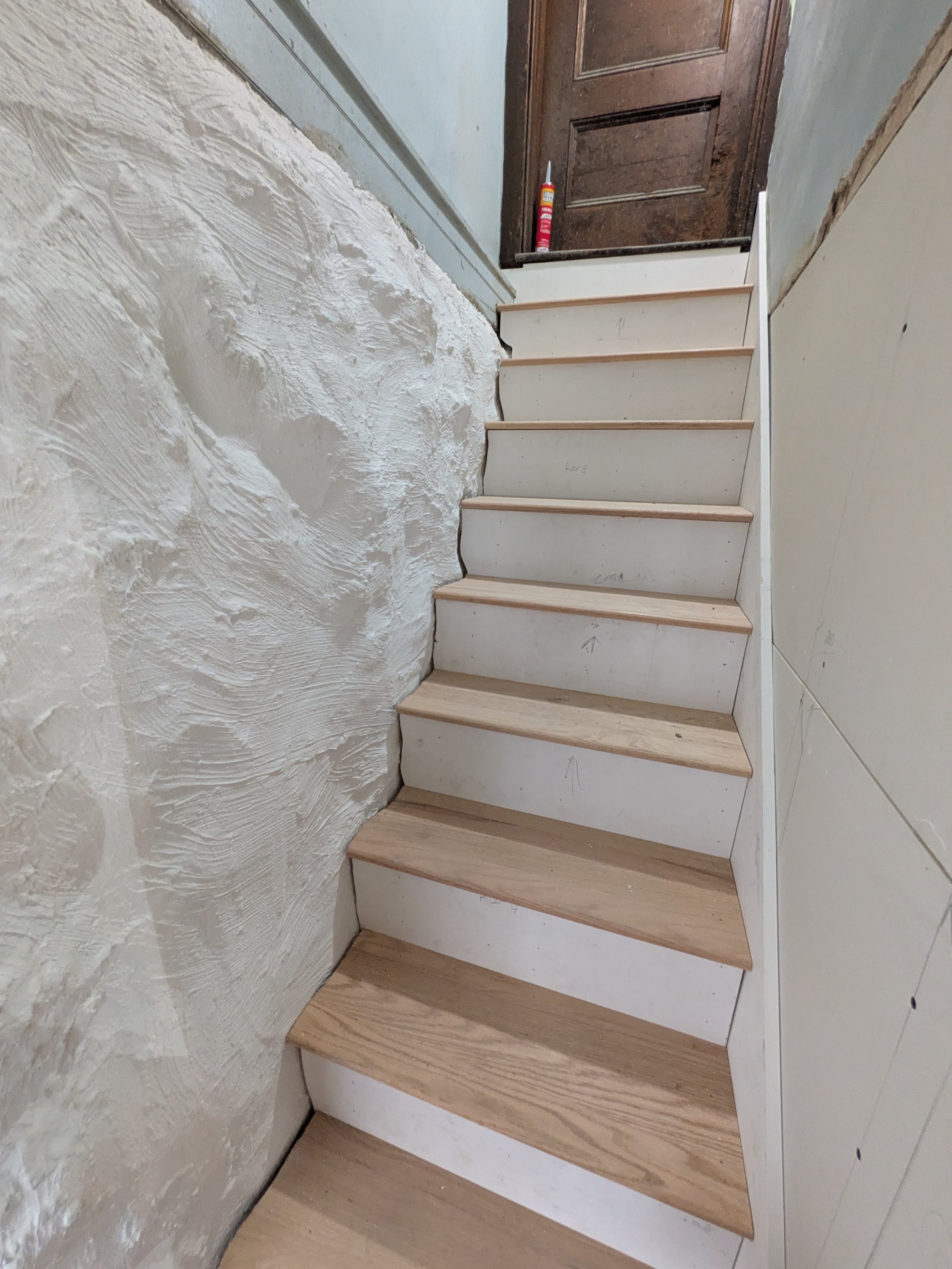 Scribed every part of these basement stair treads and risers to the stone wall
