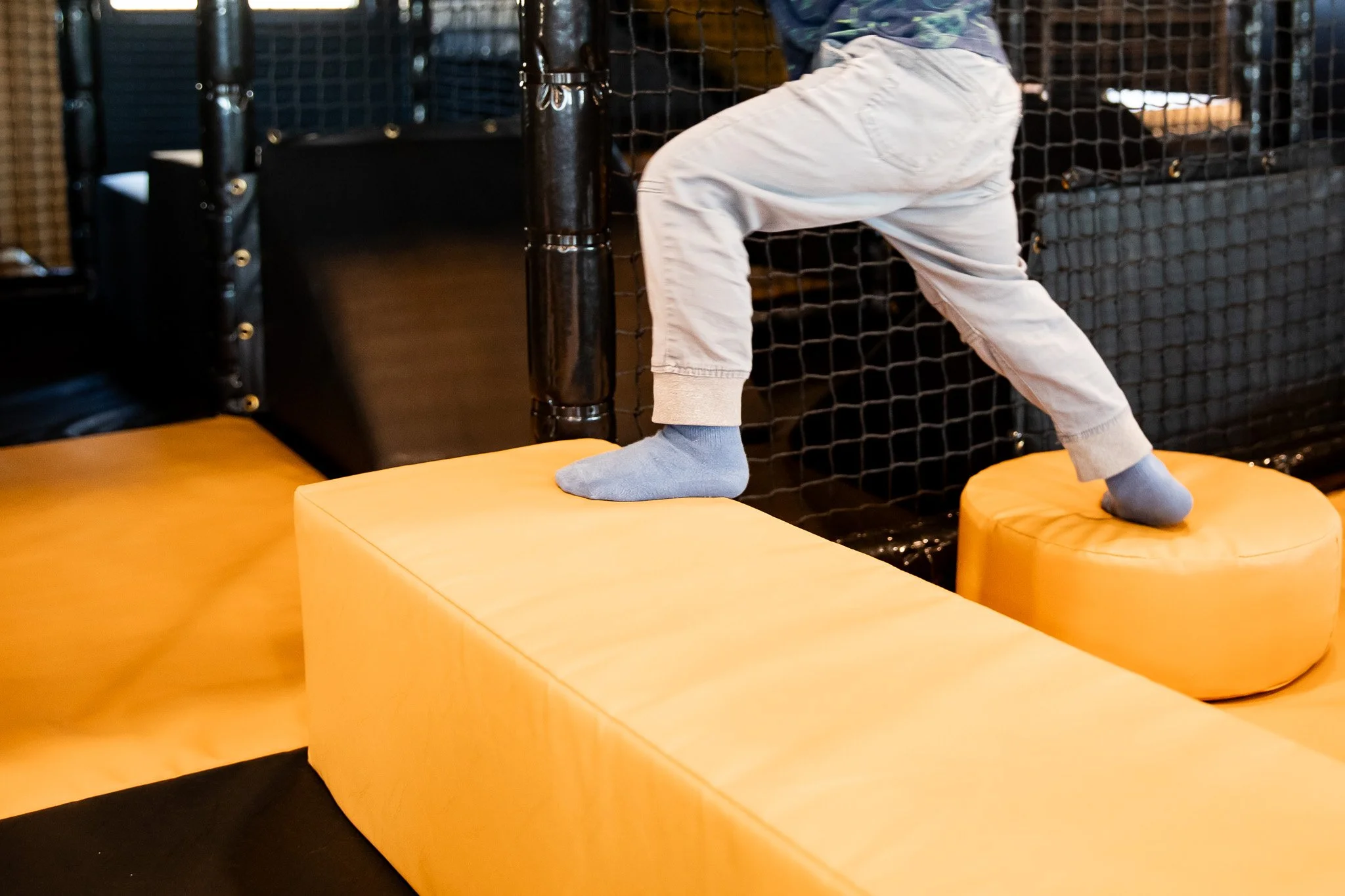 kid playing on foam blocks