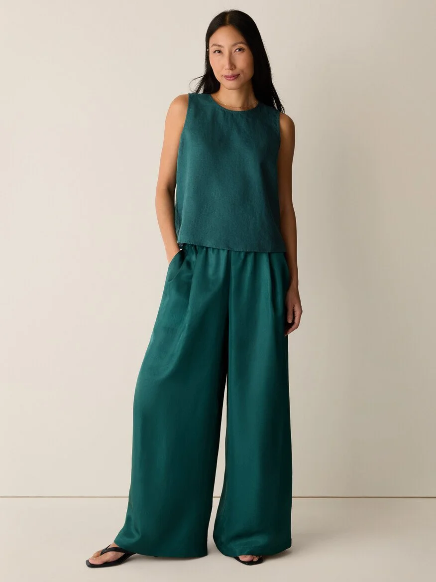 Women in two-piece silk green outfit from Eileen Fisher