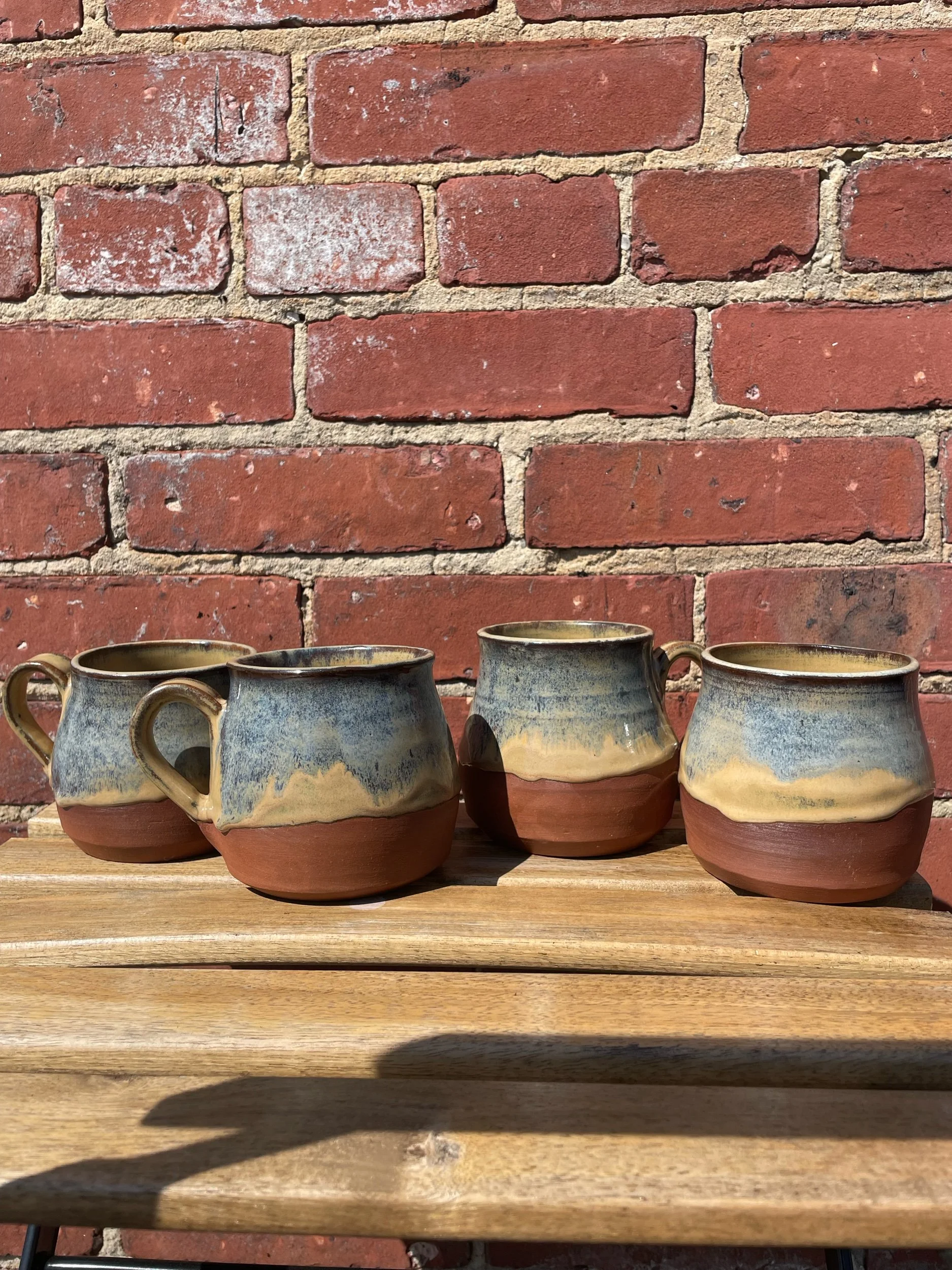 Set of 4 tan and blue mugs