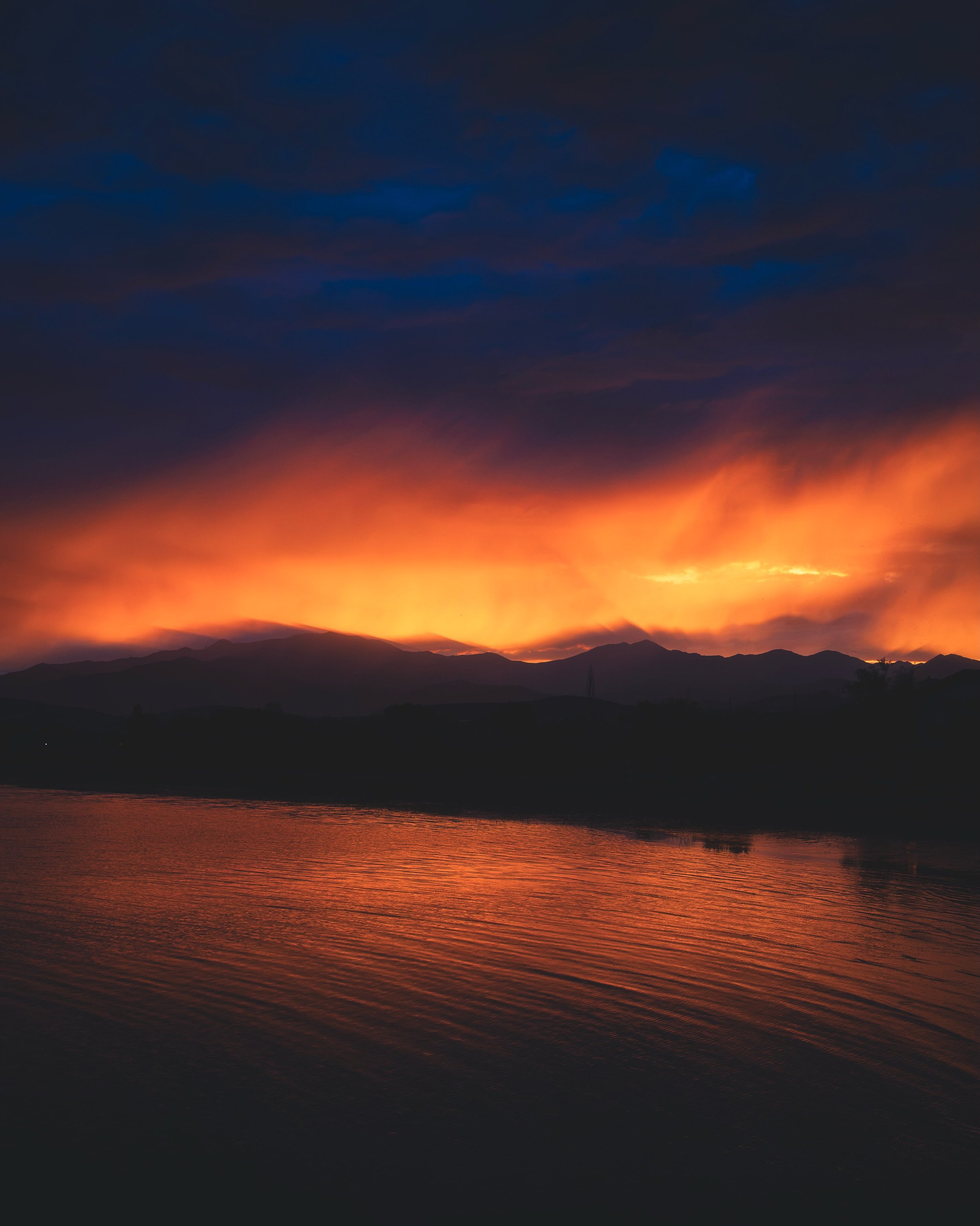 Fire in the sky reflected on Utah lake. Aug 13, 2026