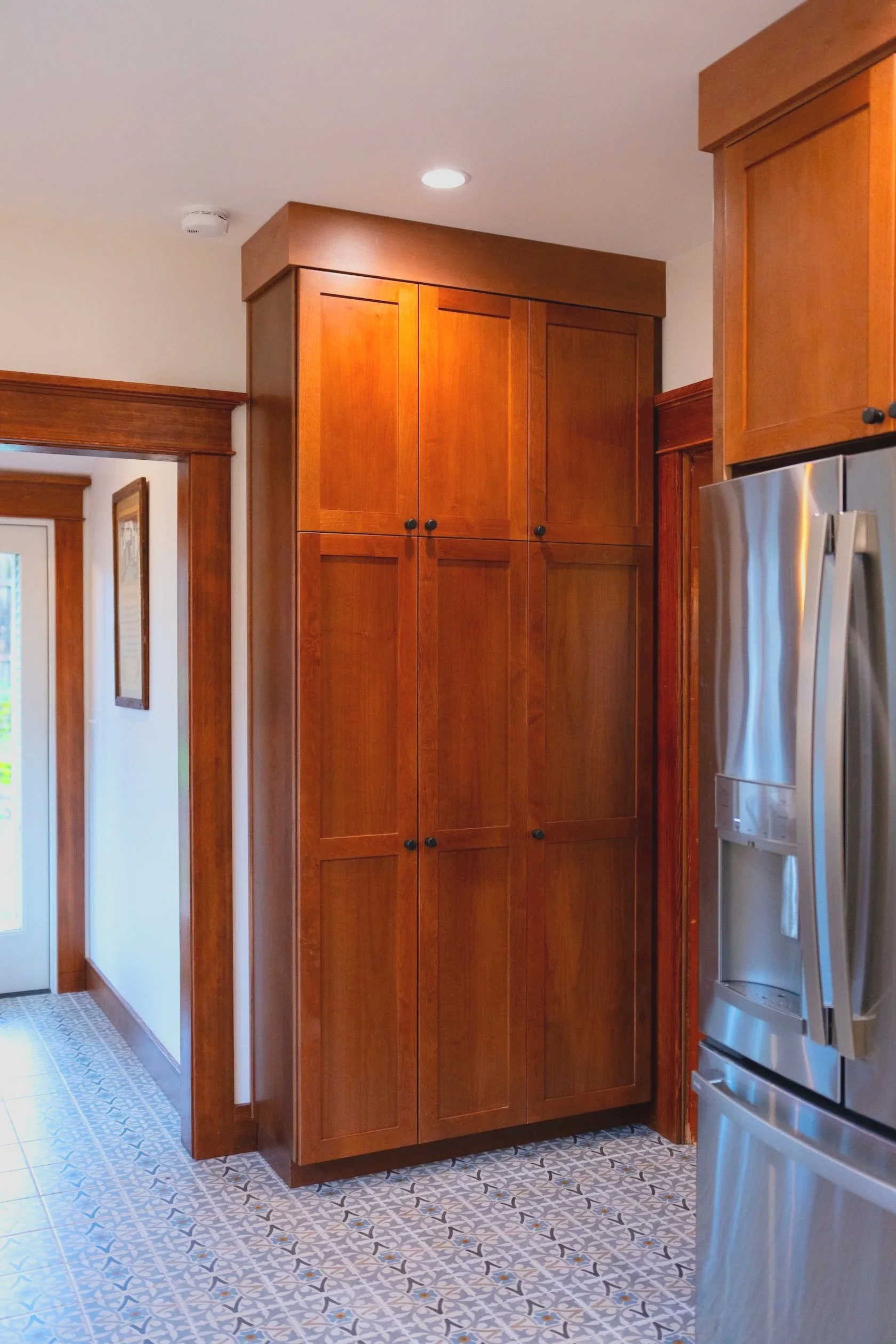 These custom cabinets were made to match the 1915 millwork with built-ins.