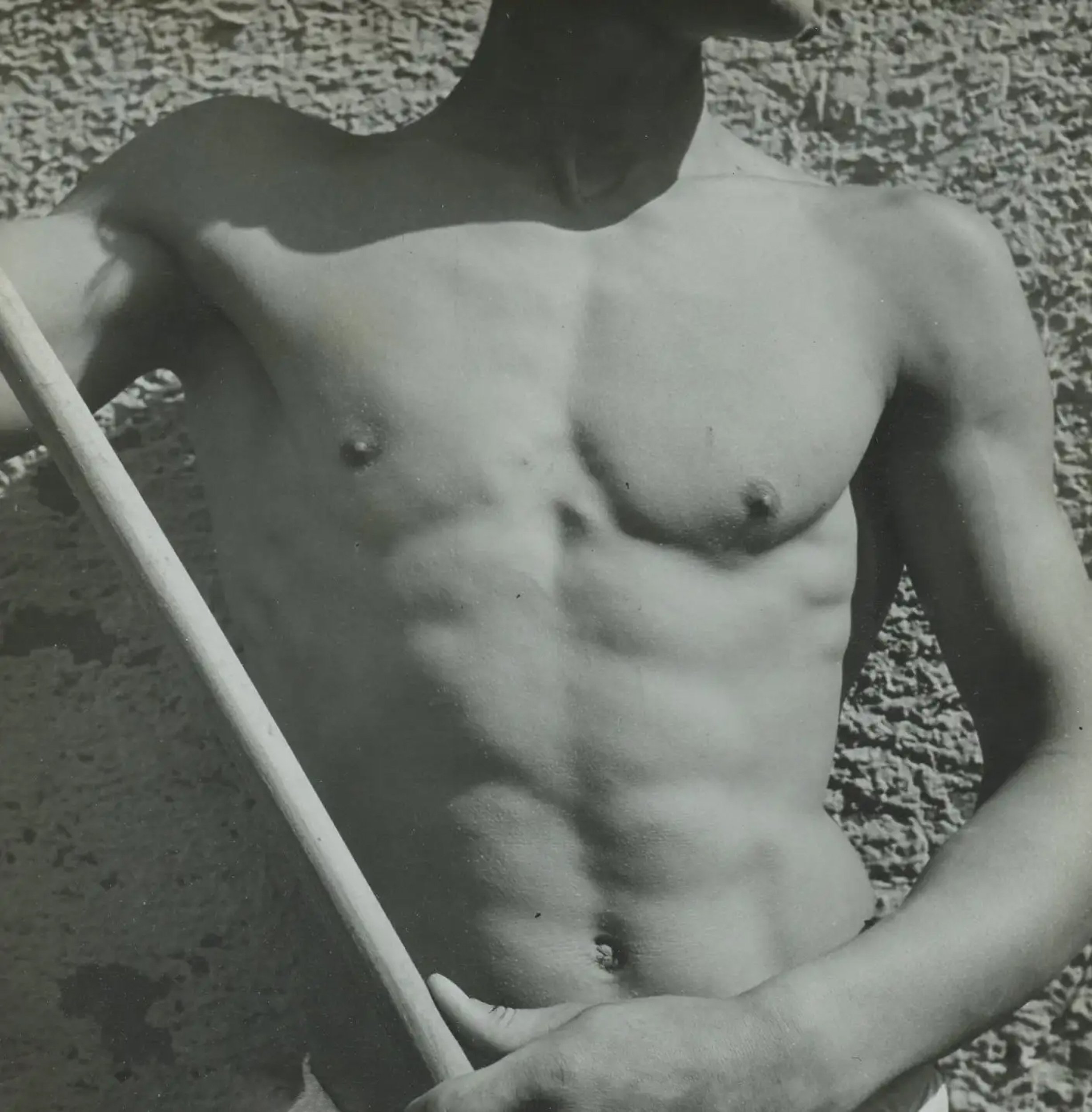    Raymond Voinquel      A vintage photograph of a shirtless young man holding a broom. Voinquel ((1912-1994) was an important French photographer known for his many studies of young men and his portrayals of Jean Marais and others involved in the mo