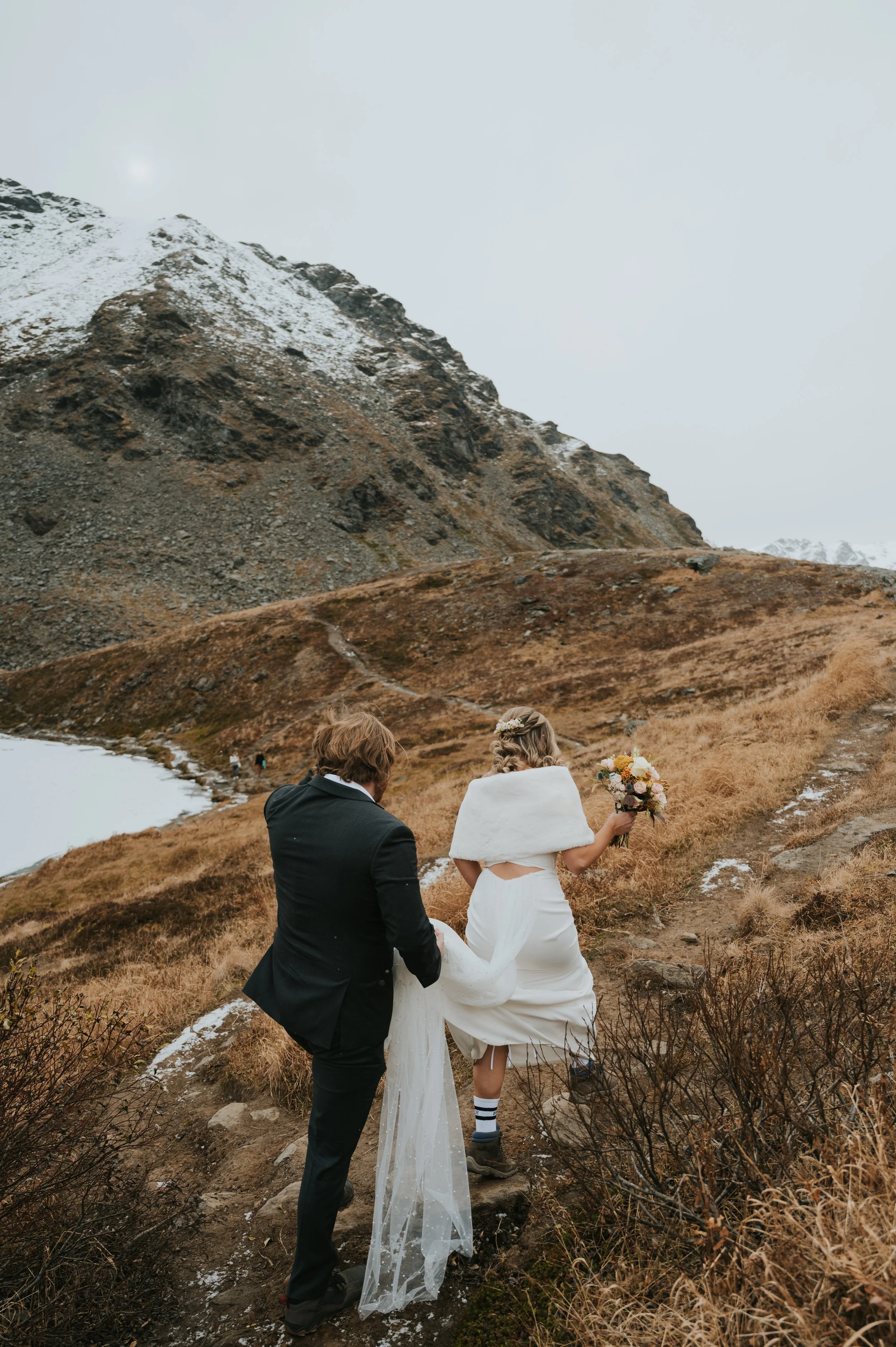 bride and groom hiking 