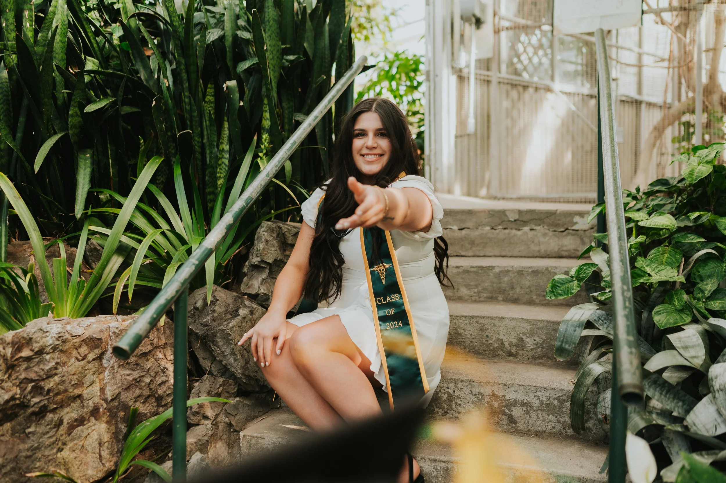girl tossing grad cap