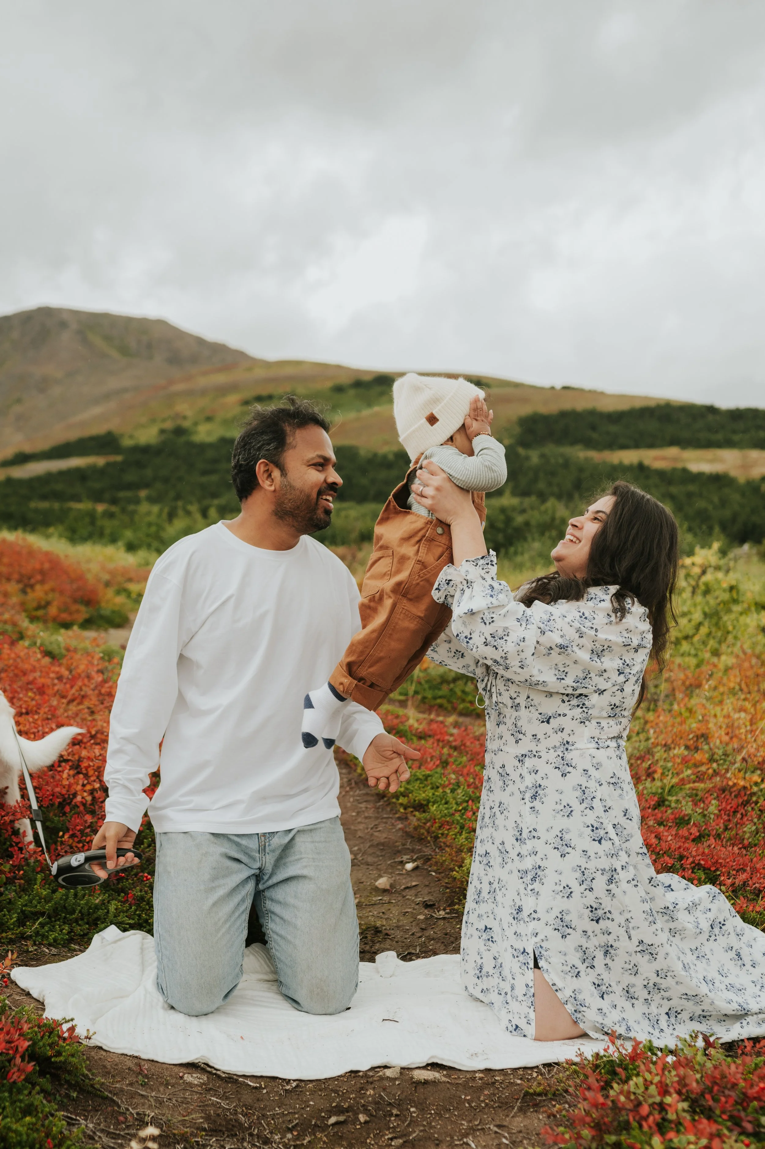 family in fall on hillside