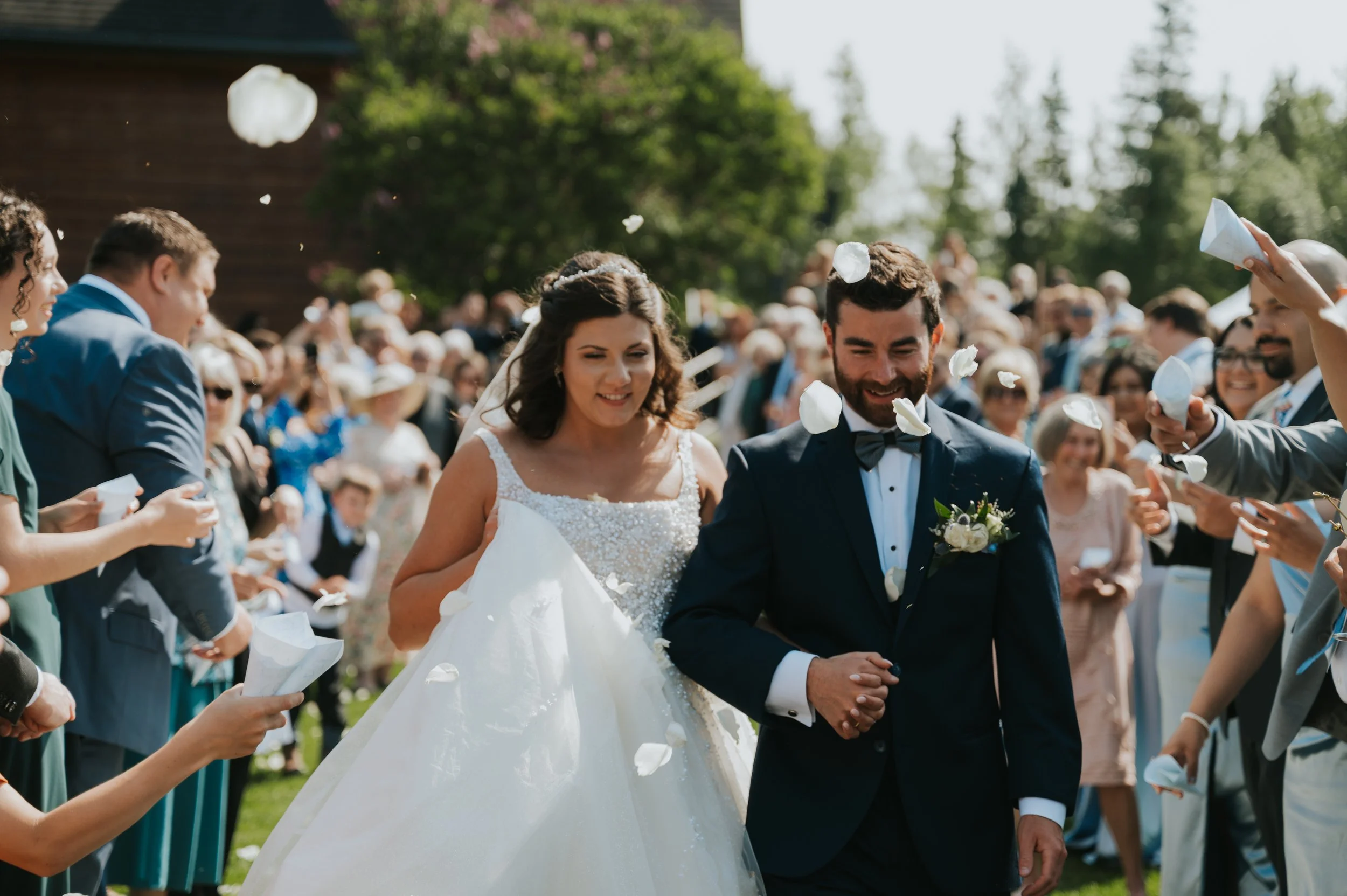 bride and groom sendoff with petals