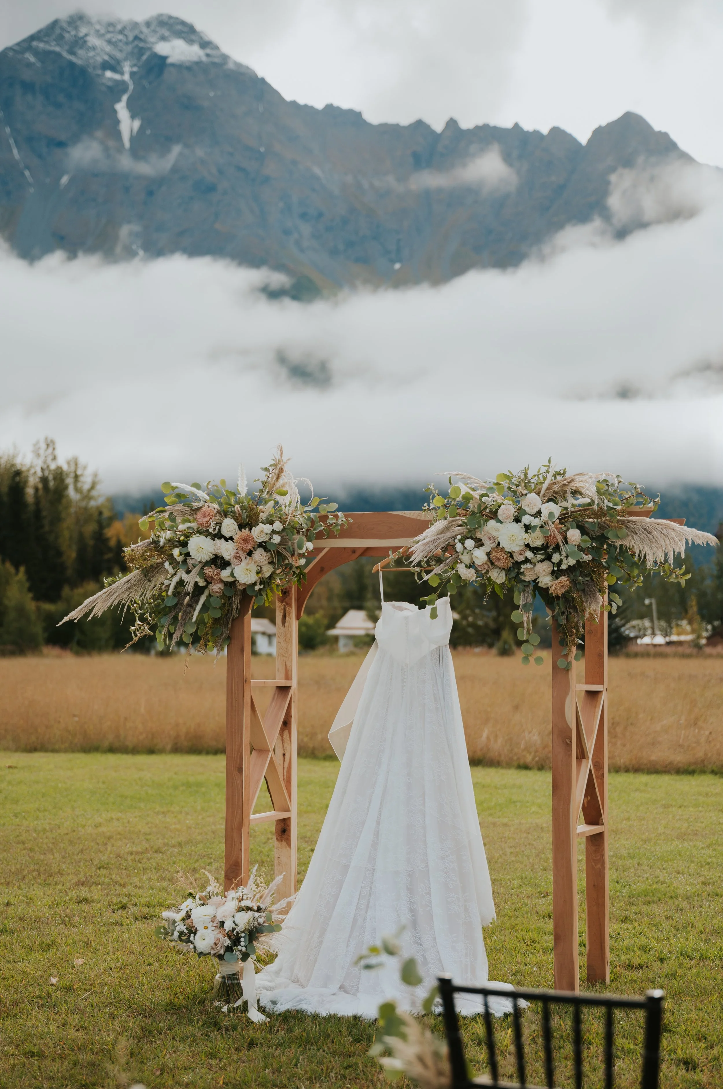 wedding dress hanging up on altar 