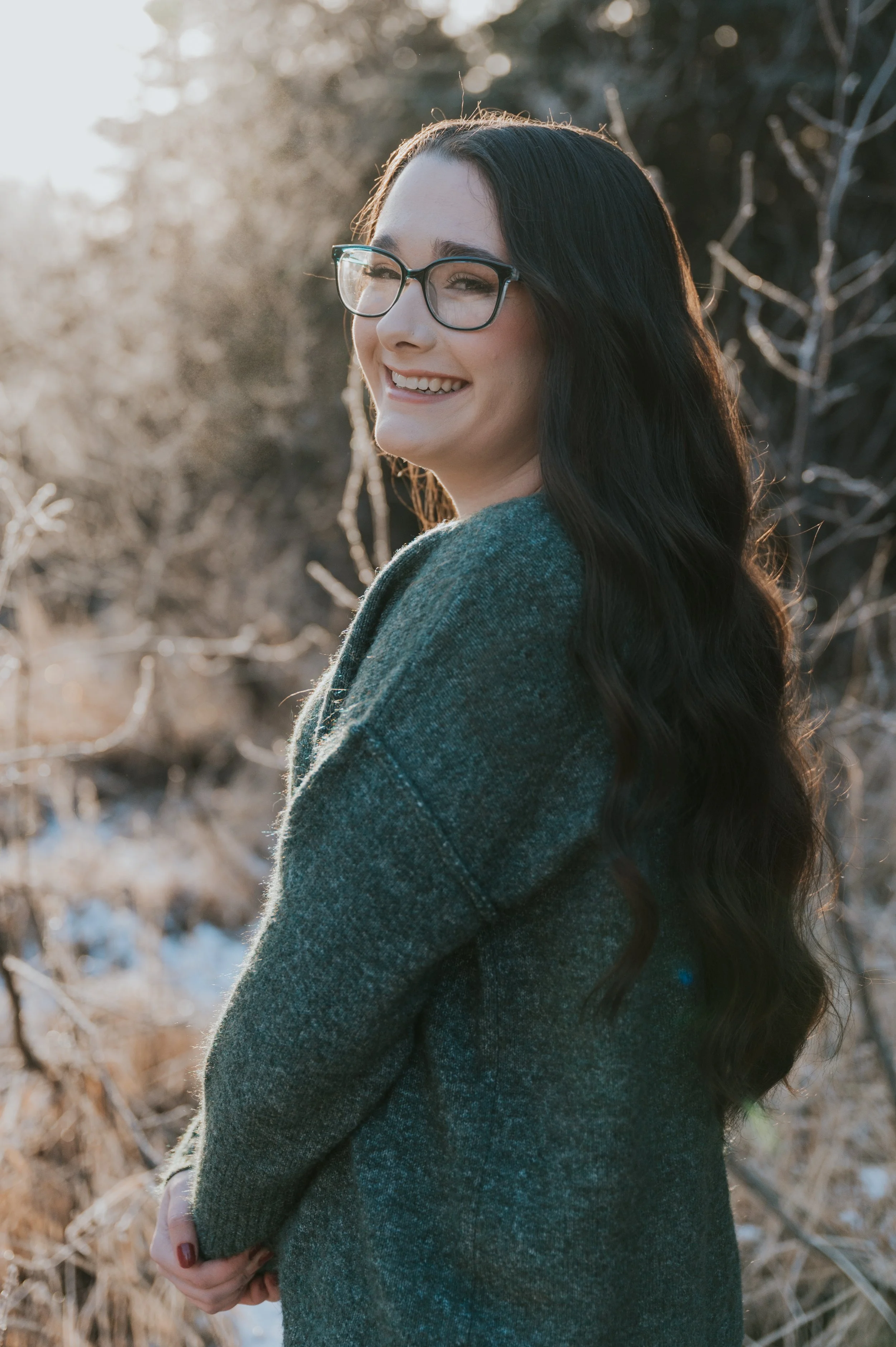 girl smiling in cold at camera