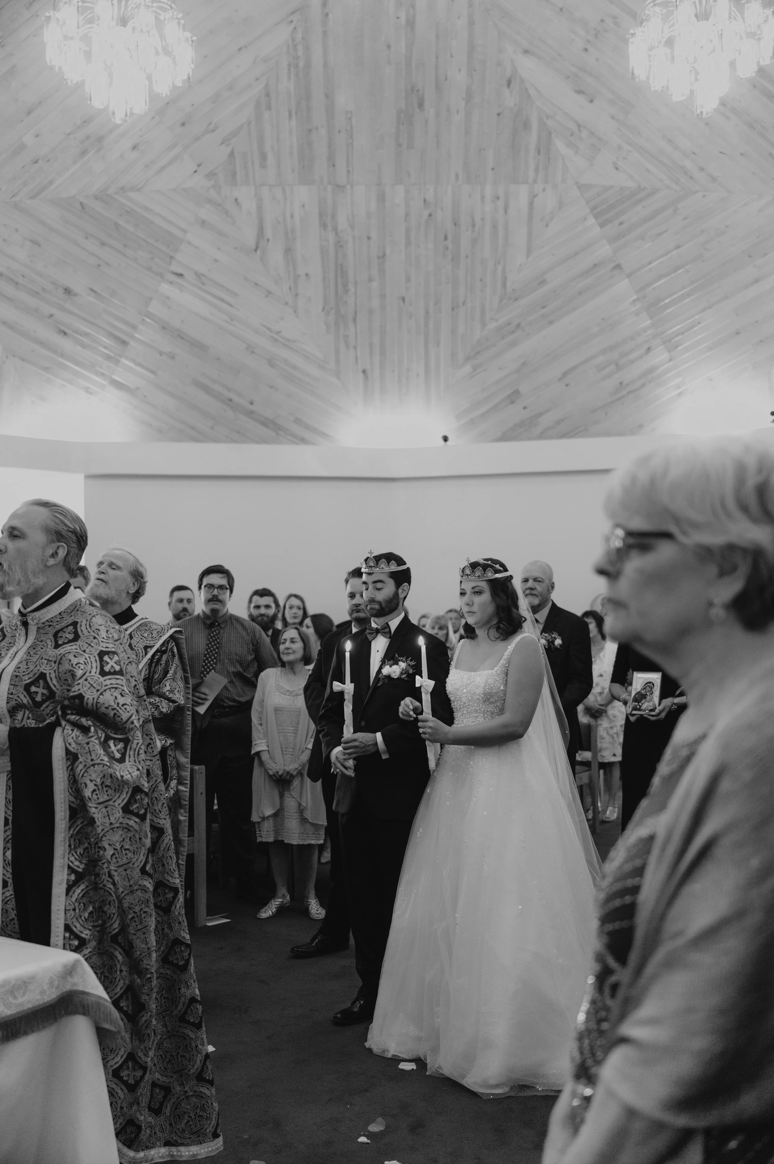 bride and groom in orthodox wedding wearing crowns
