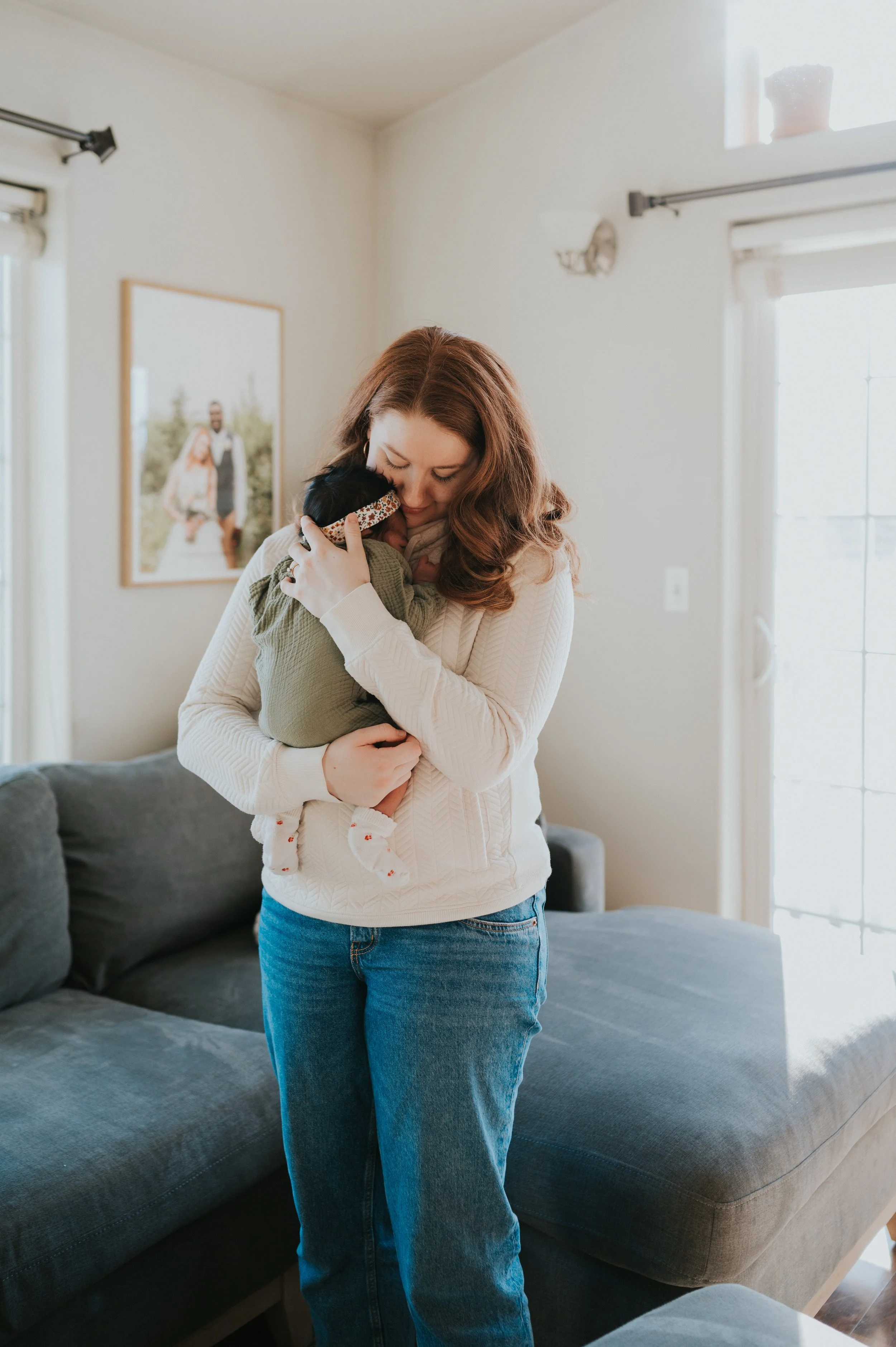 mom holding newborn baby