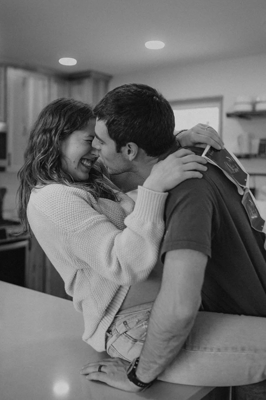 couple cozy in kitchen with ultrasound