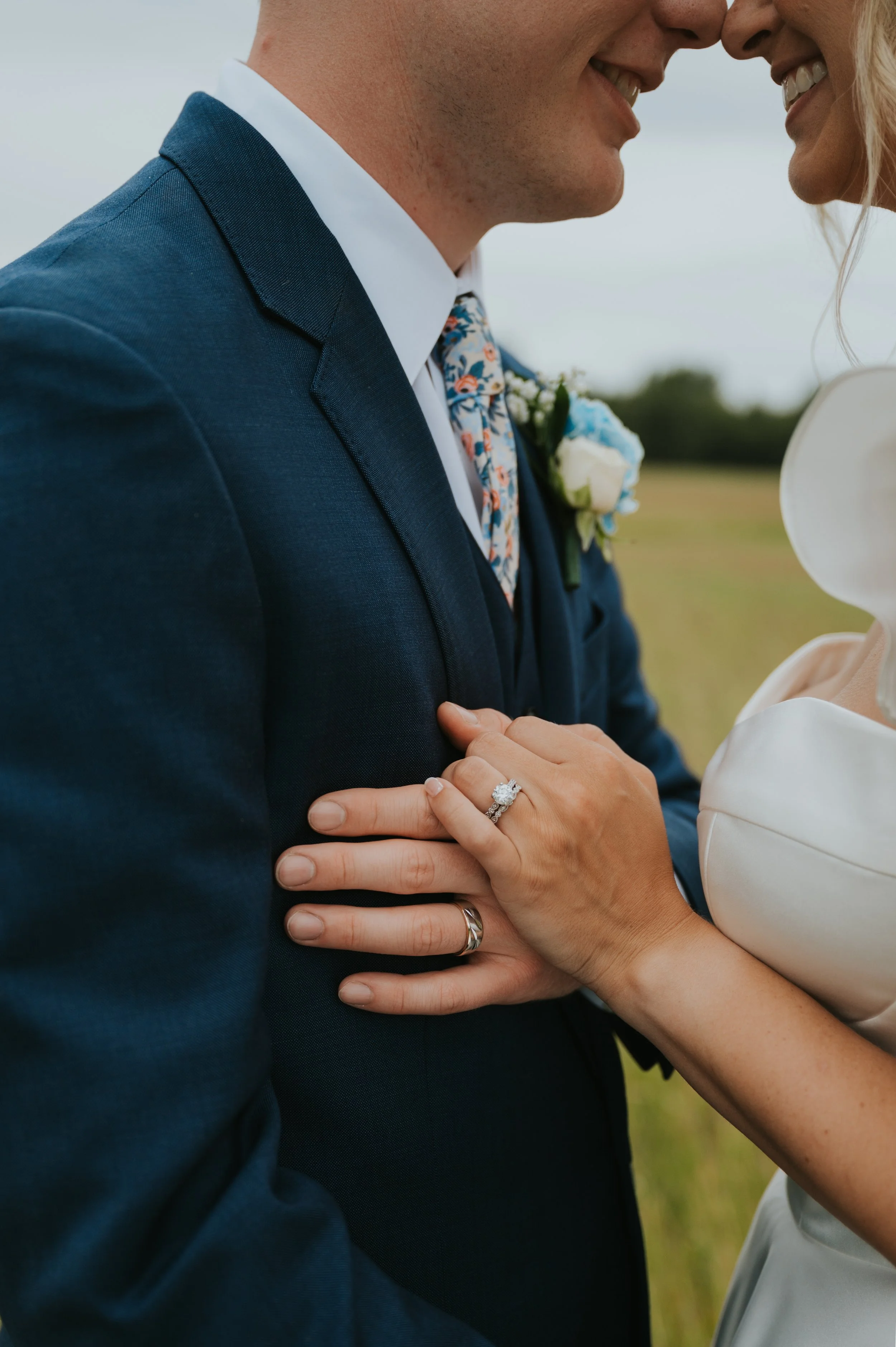 closeup of couples hands and rings on wedding day