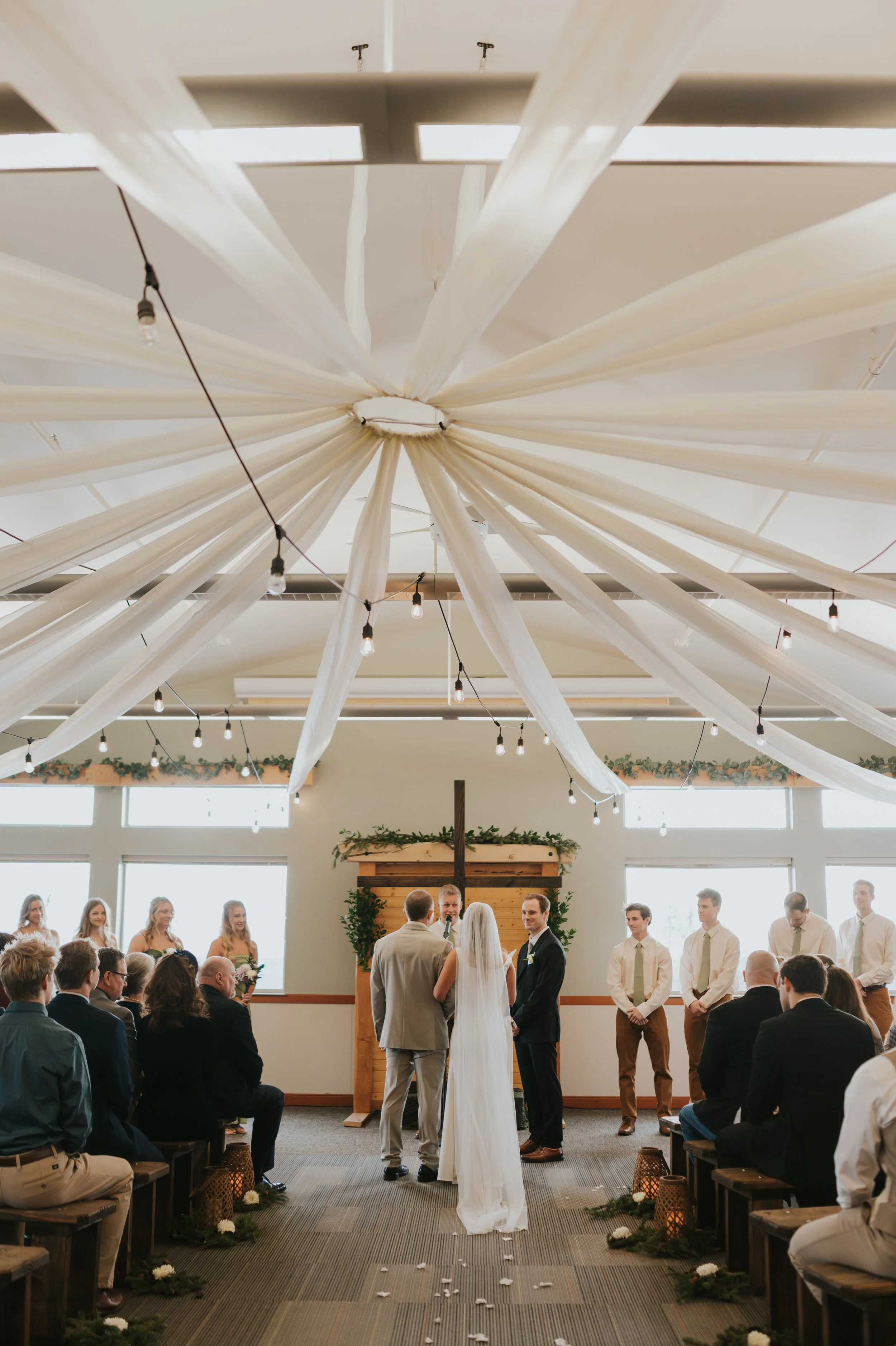 father handing bride off to groom at altar