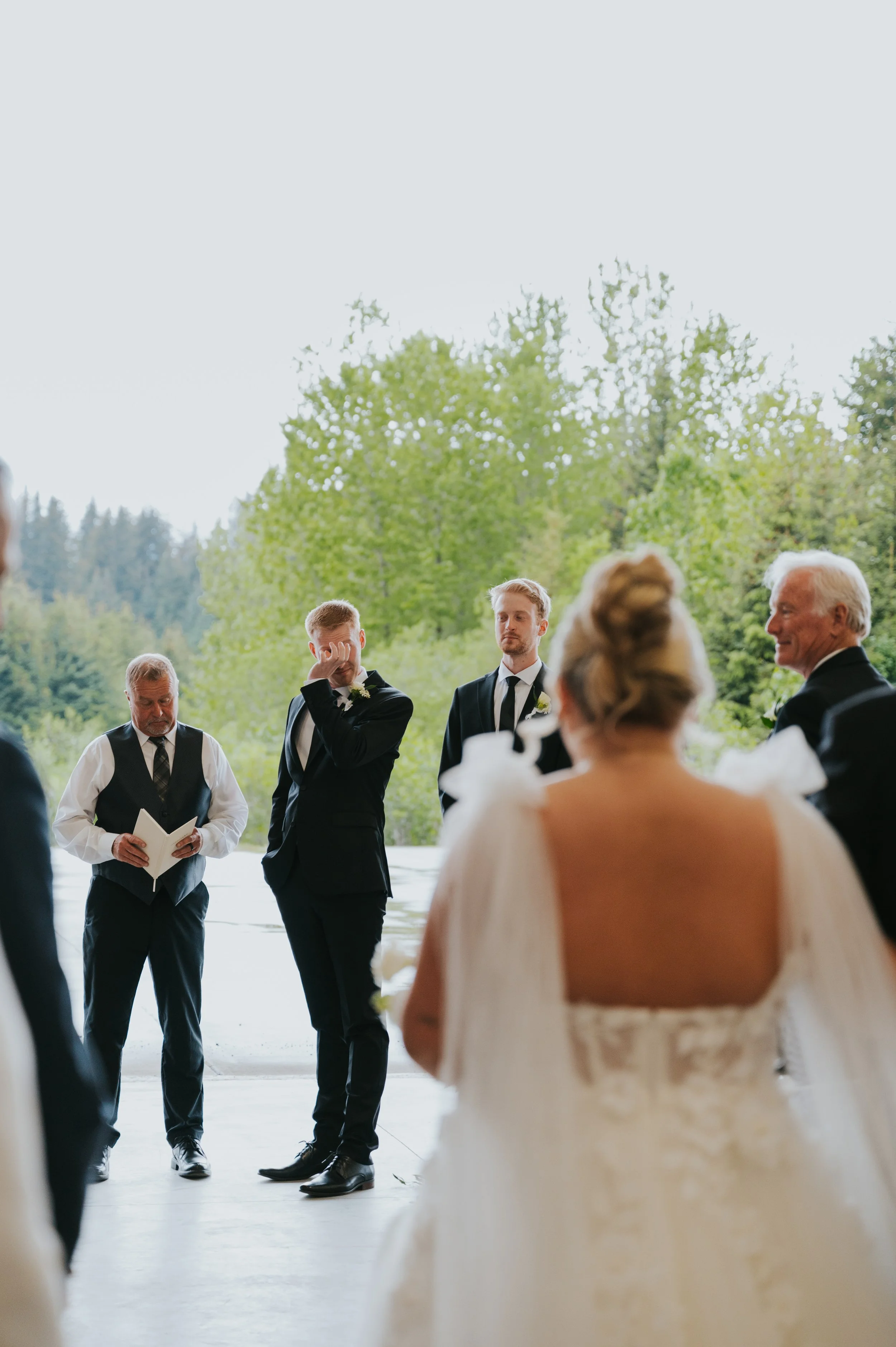 groom crying as bride walks down aisle