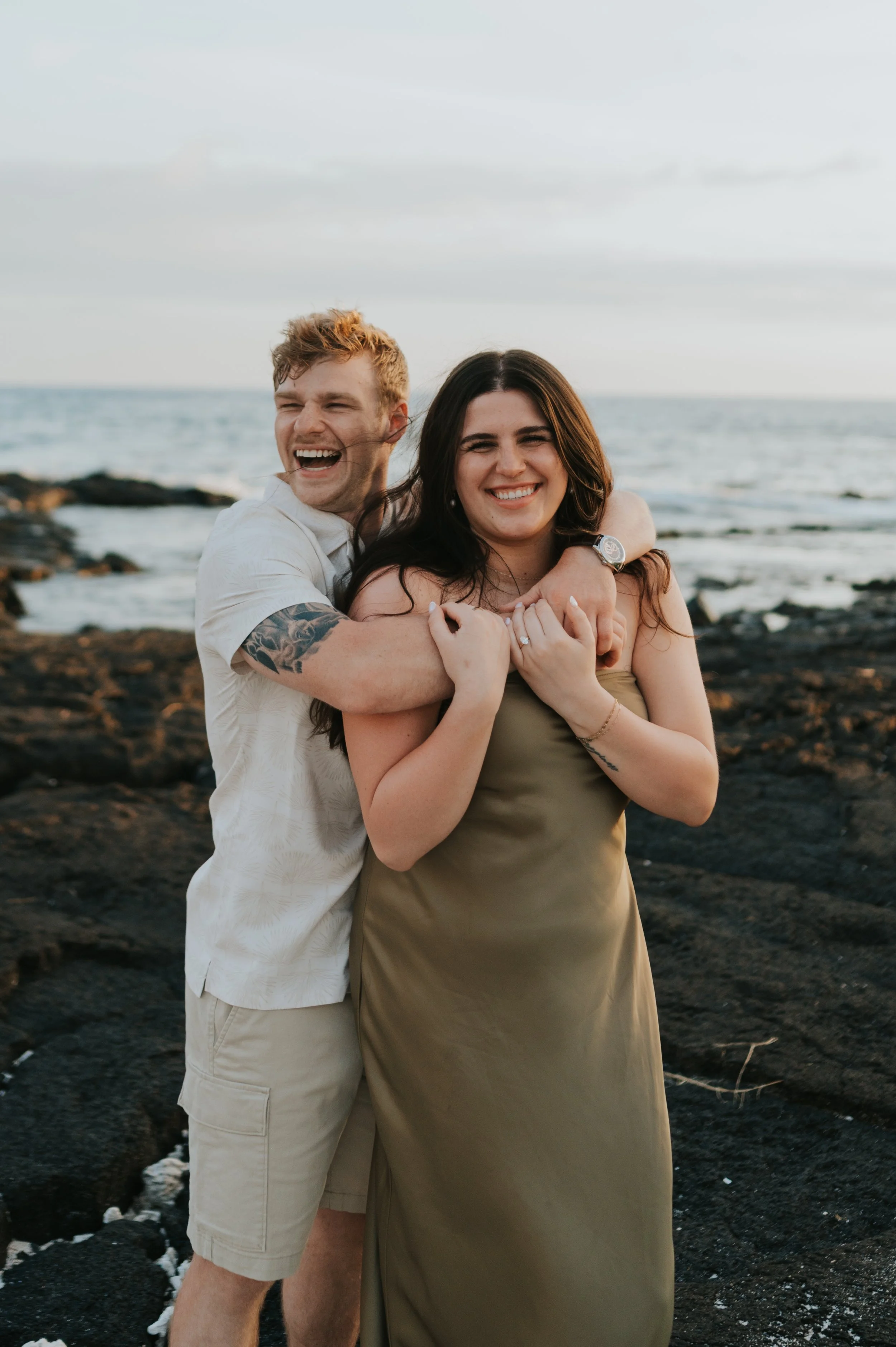 engaged couple on beach in hawaii