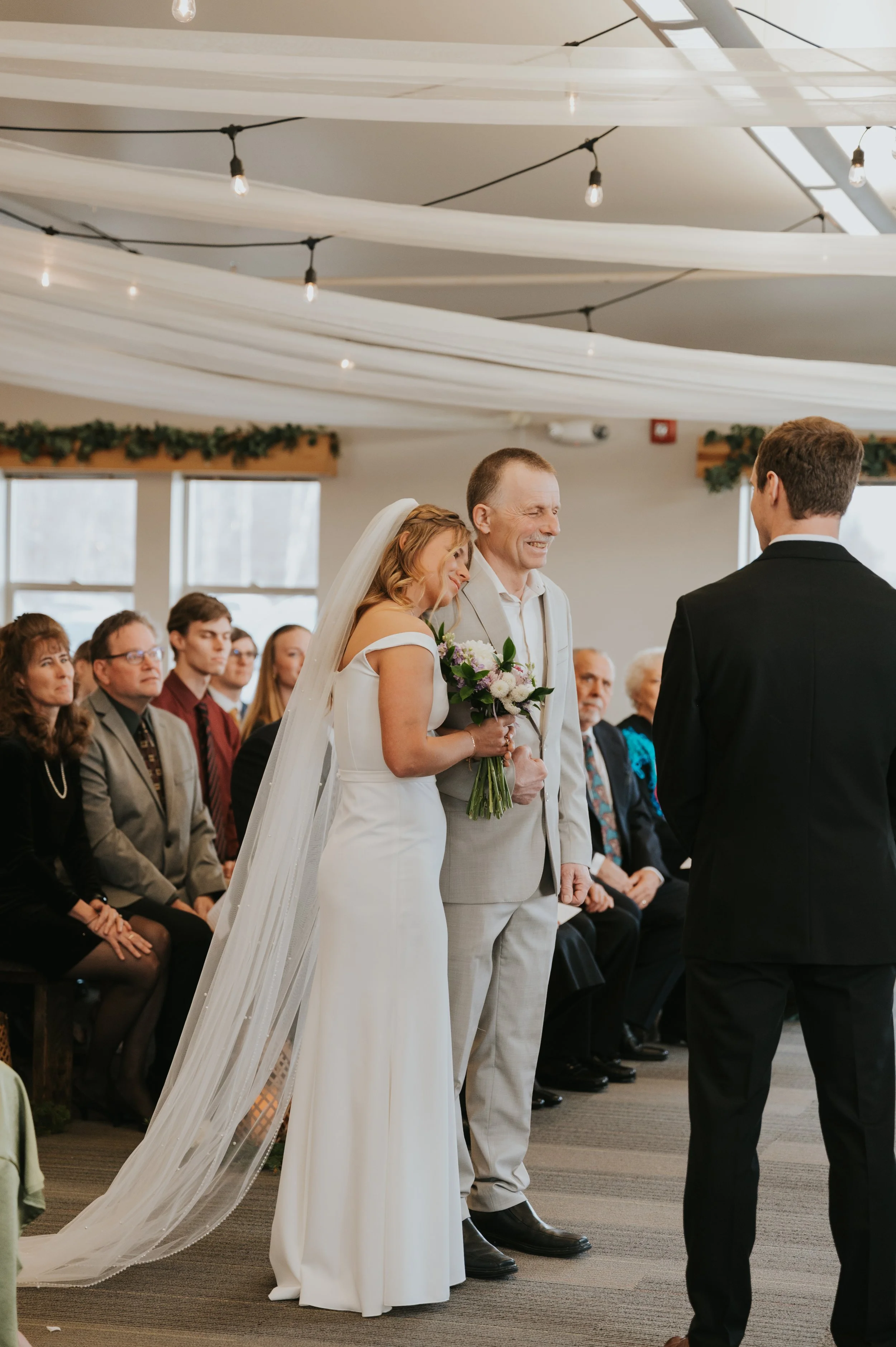 bride at altar with father