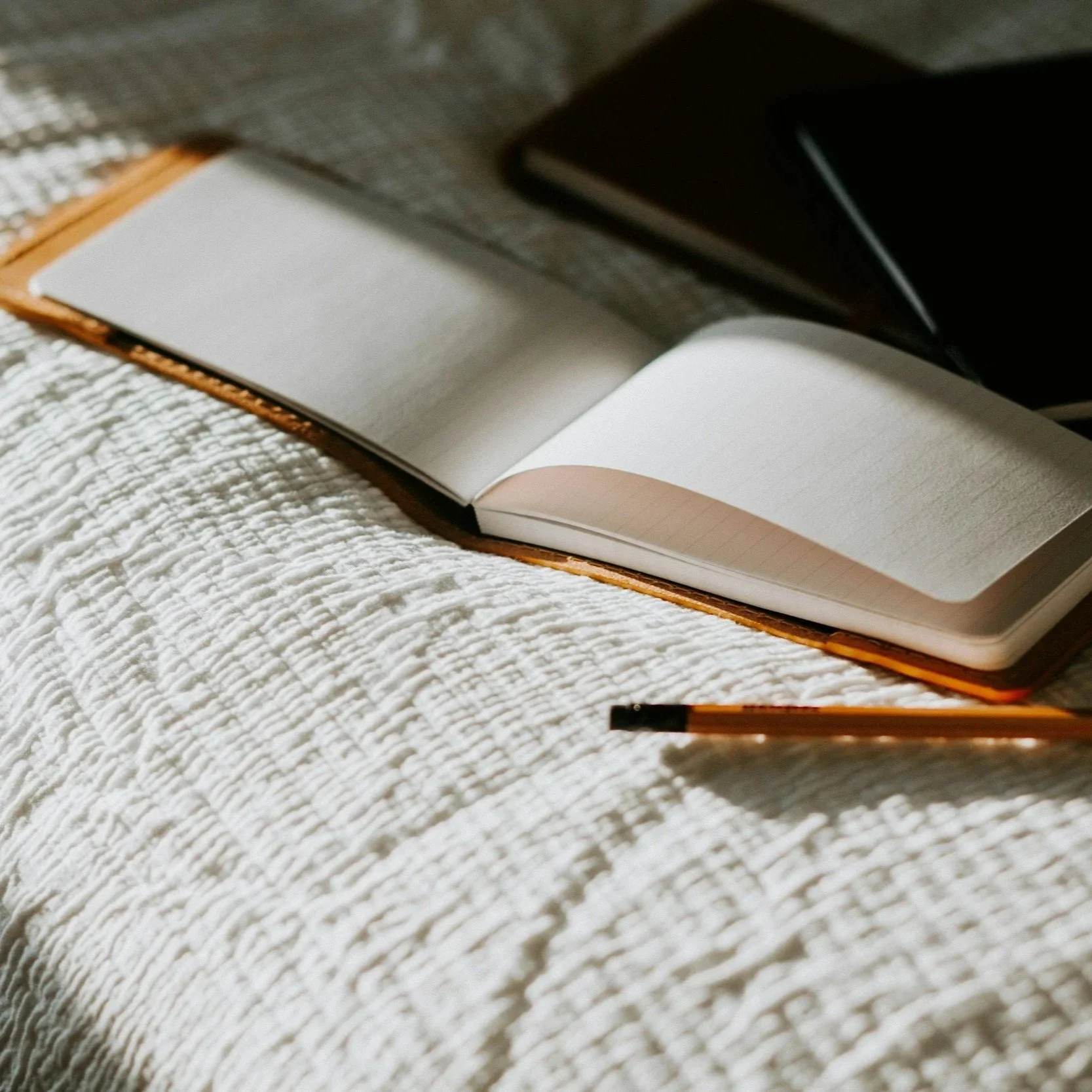 Geometric drawing of an outline square with sections divided by vertical, horizontal, and diagonal lines.