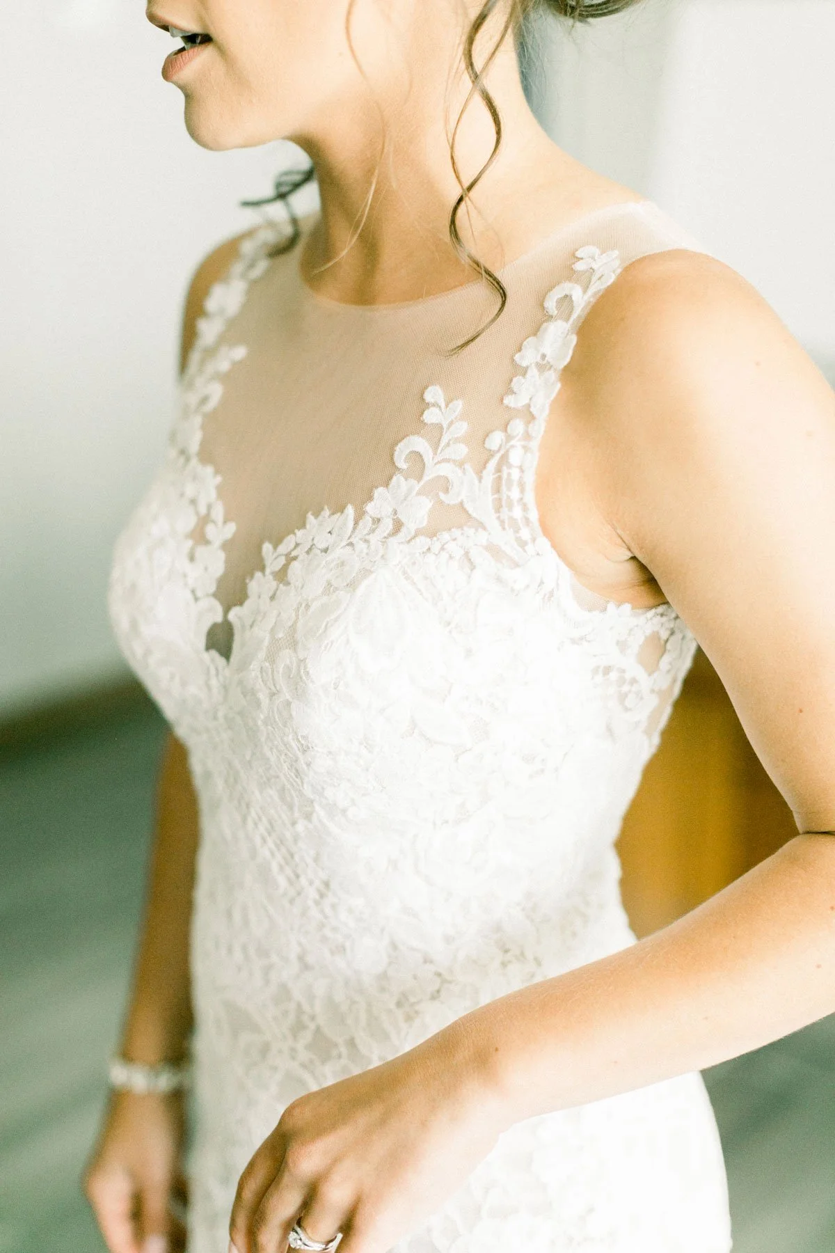 Bride in fitted wedding dress showing toned physique from bridal fitness program
