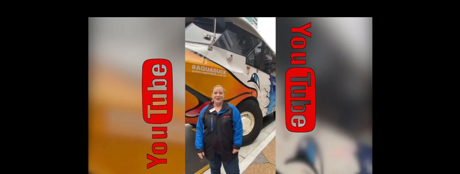 A woman standing in front of a colorful bus with a duck logo, with a message overlaid that reads 'Subscribe YouTube'