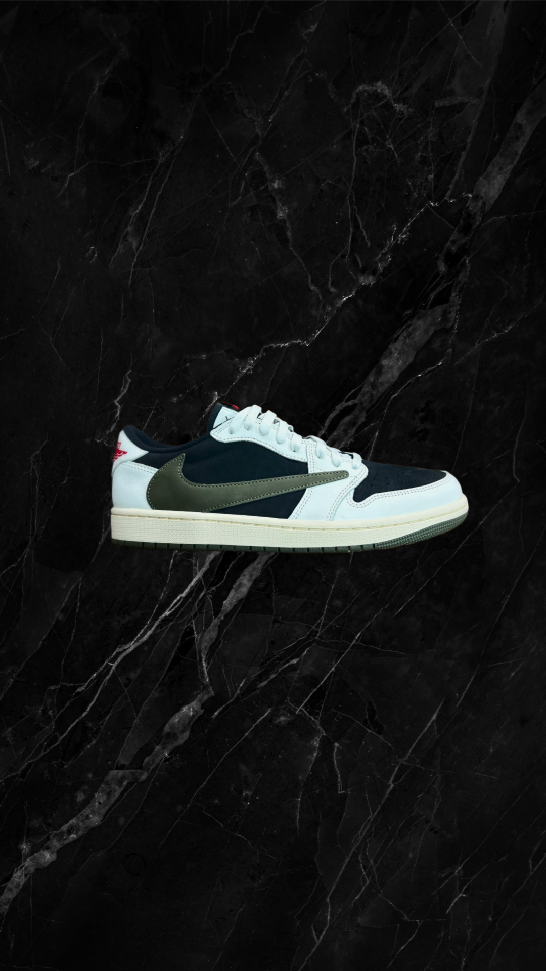 A sneaker with white, navy, and olive green colors on a black marble surface.