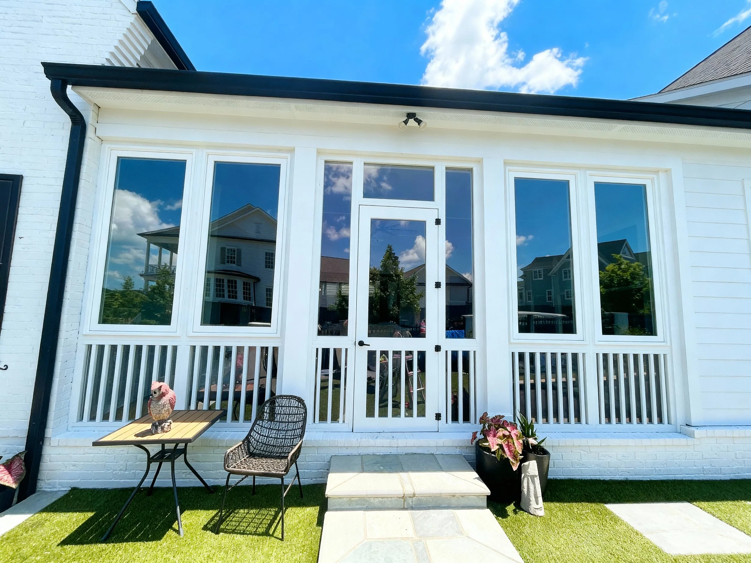 An image of a White House with a full wall of windows