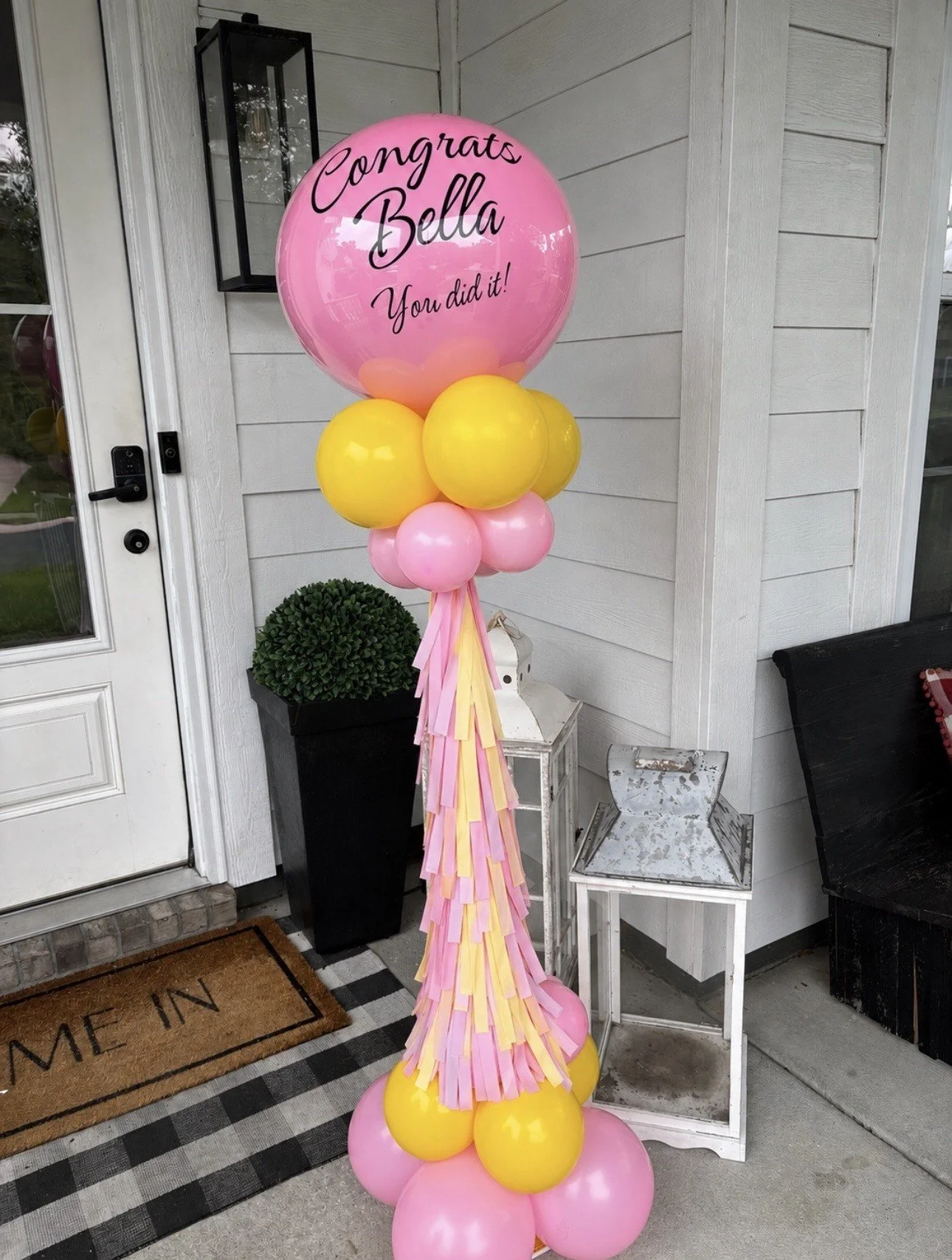Pink and yellow balloon stack topiary for a girls graduation