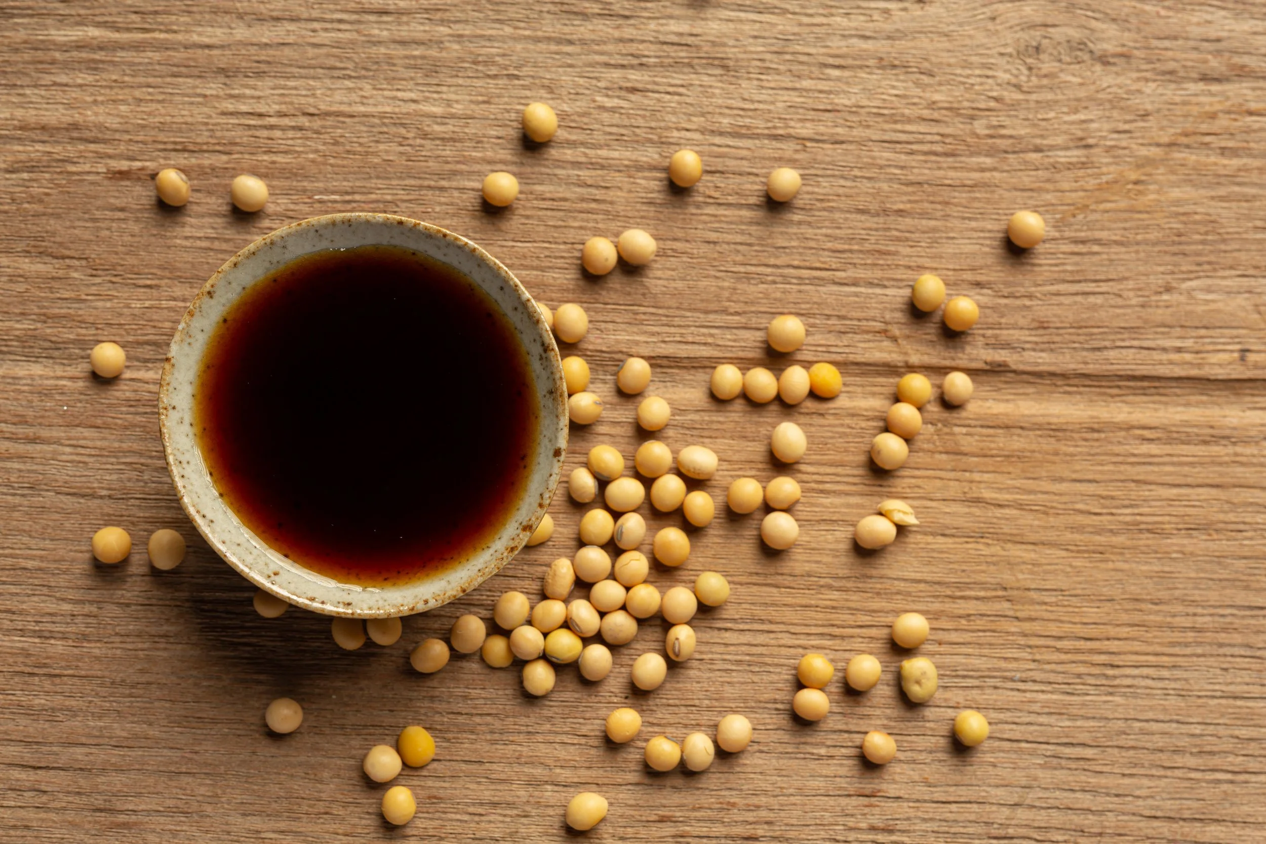 soybean-sauce-soybean-wooden-floor-soy-sauce-food-nutrition-concept.jpg