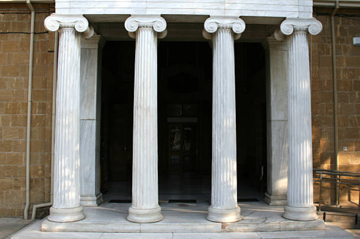 Entrance with five white classical columns supporting a porch overhang.