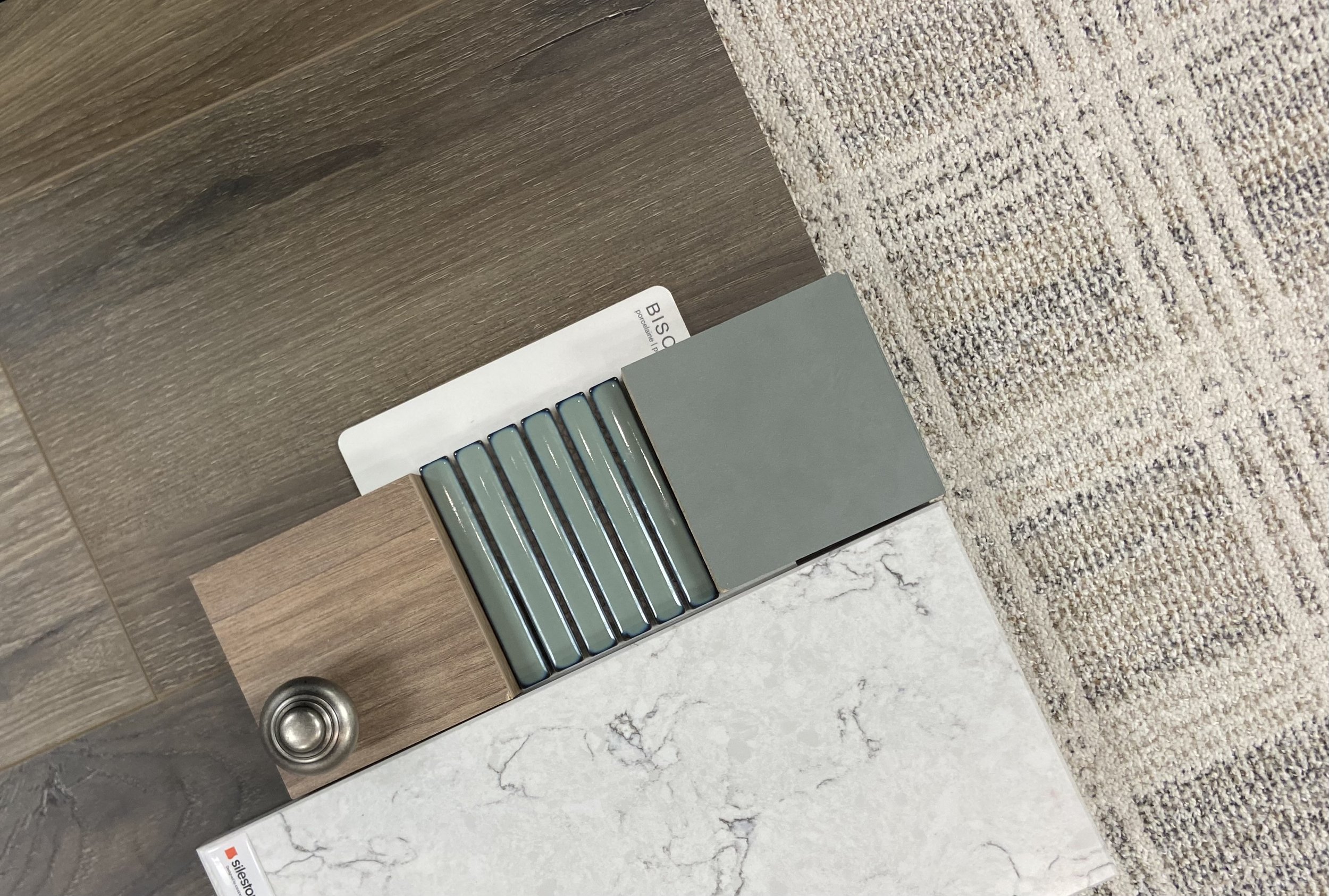 Sample of different flooring materials including wood, tile, and carpet.