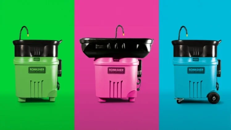 Three portable floor cleaning machines in green, pink, and blue with a black top, each on a different color background.