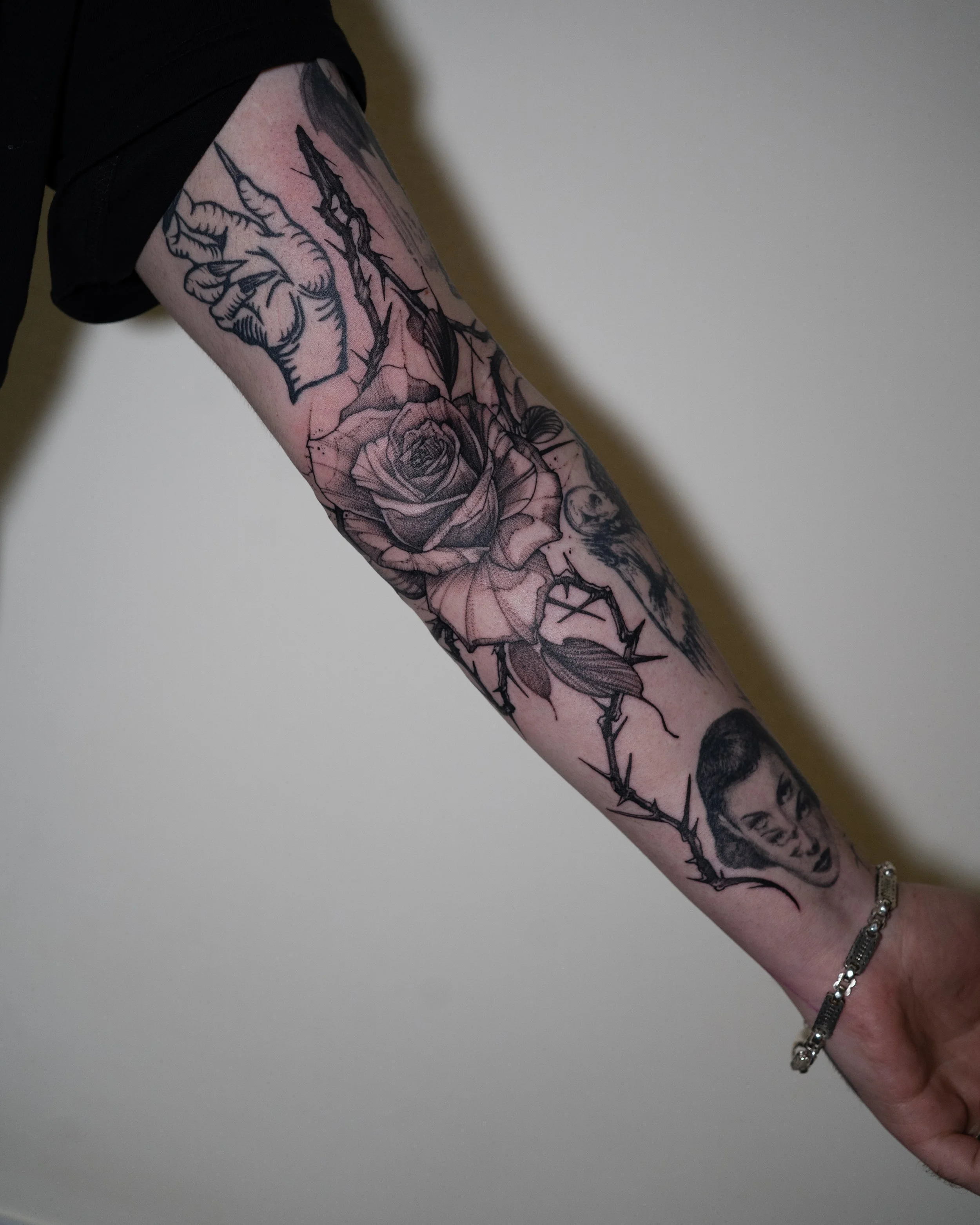 Black and grey tattoo sleeve featuring rose by Jay C Tattoo, Brighton tattoo artist, UK
