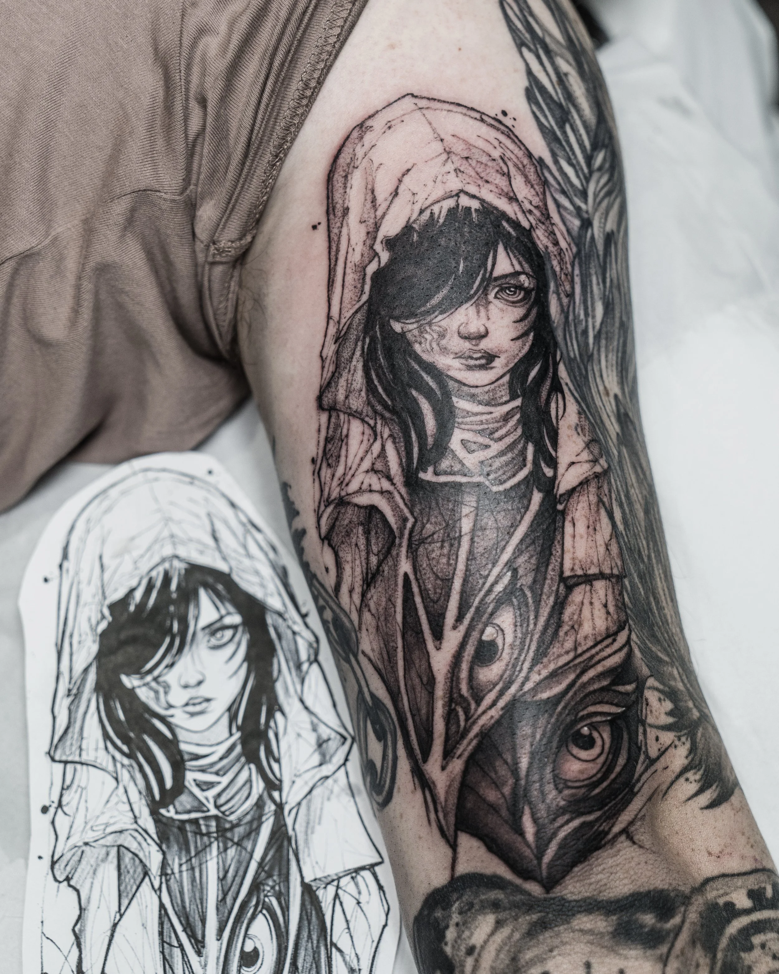 Black and grey tattoo of a hooded Witch on upper arm with original sketch by Jay C Tattoo, Brighton and Hove tattoo artist, UK
