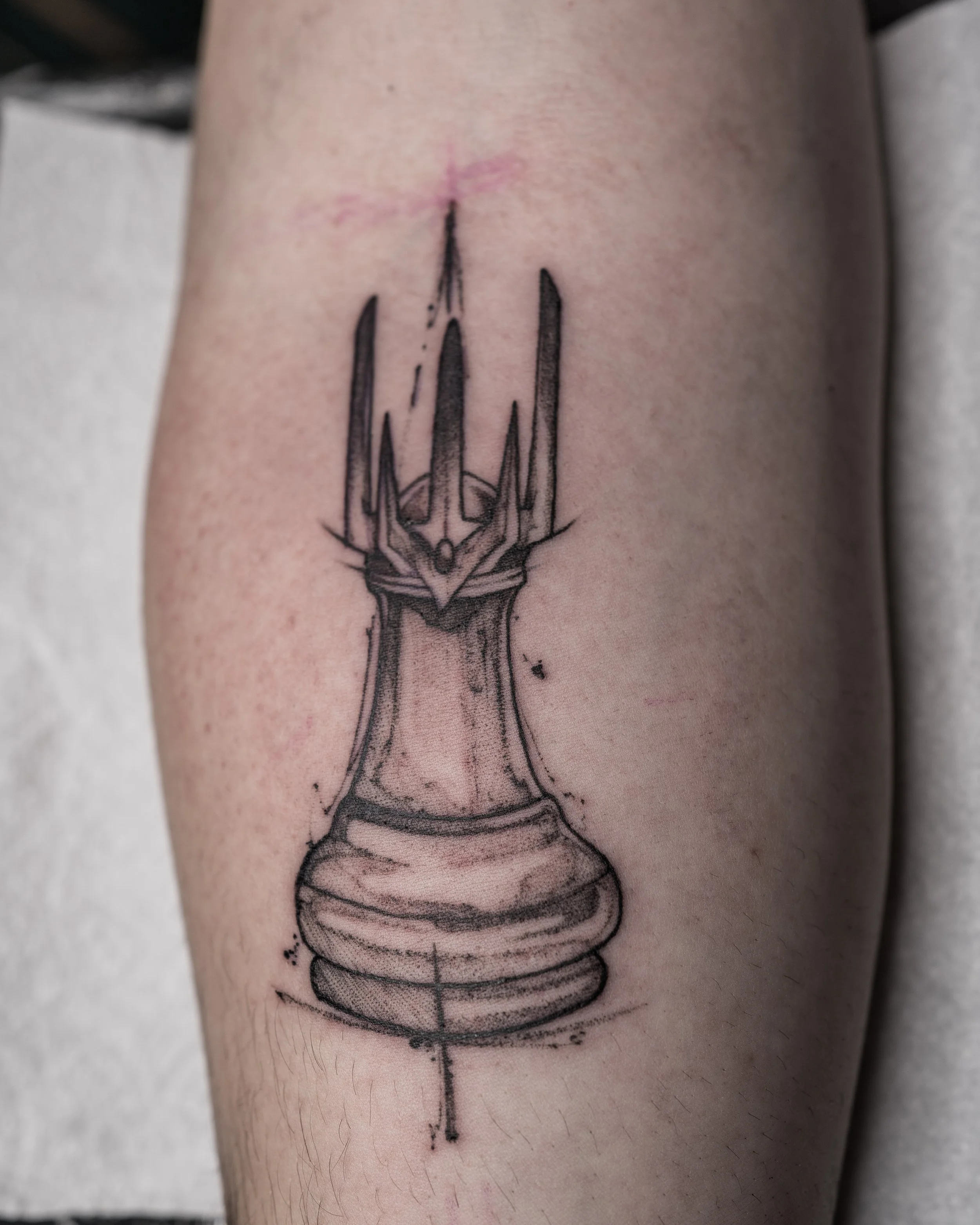 Black ink tattoo of a chess pawn with lord of the rings helmet design by Jay C Tattoo, Brighton tattoo artist, UK

