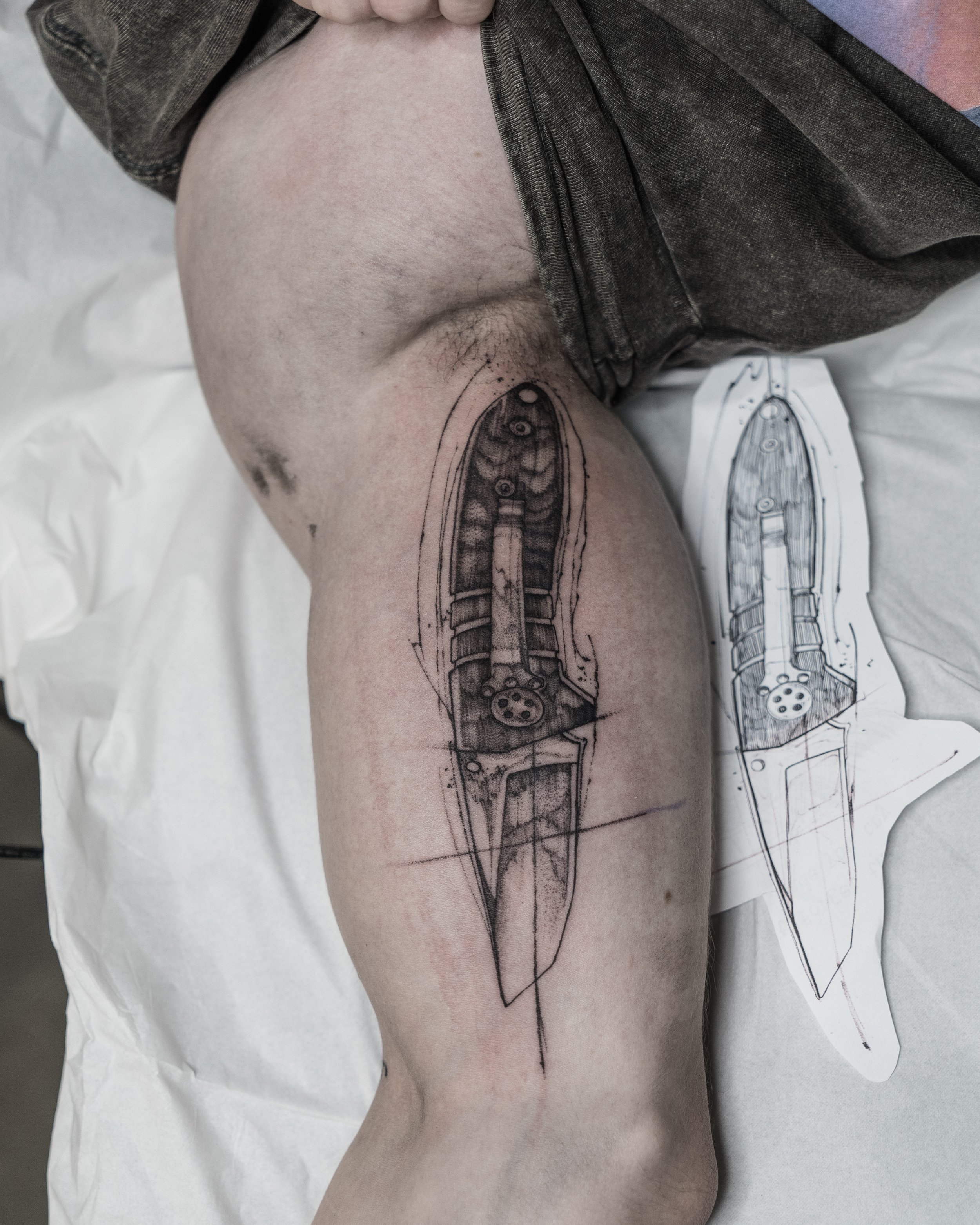 Tattoo design of a combat knife on bicep with stencil and sketch by Jay C Tattoo, Brighton and Hove tattoo artist, UK
