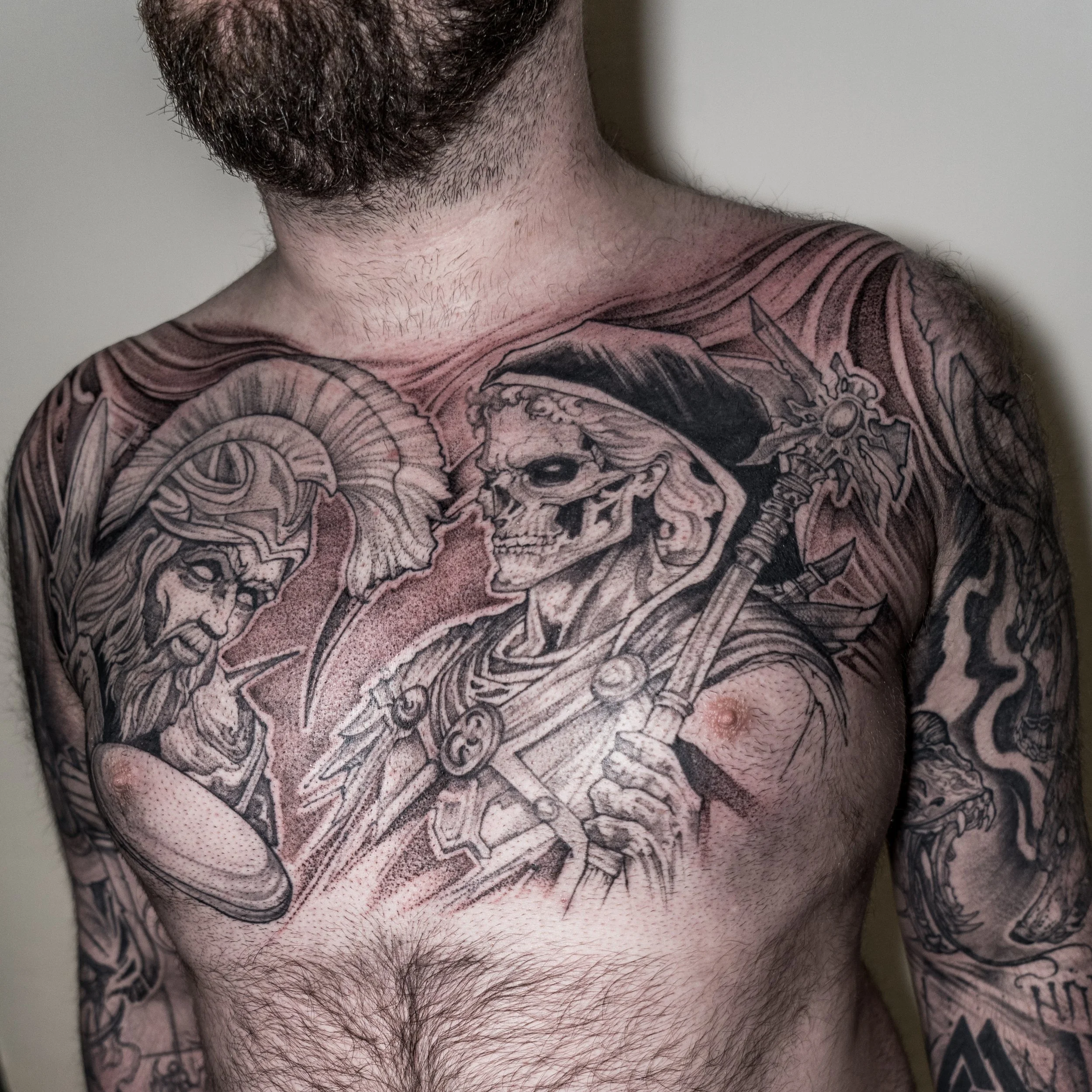 Black and grey chest tattoo of a skeleton warrior with sword and fantasy elements by Jay C Tattoo, Brighton tattoo artist, UK
