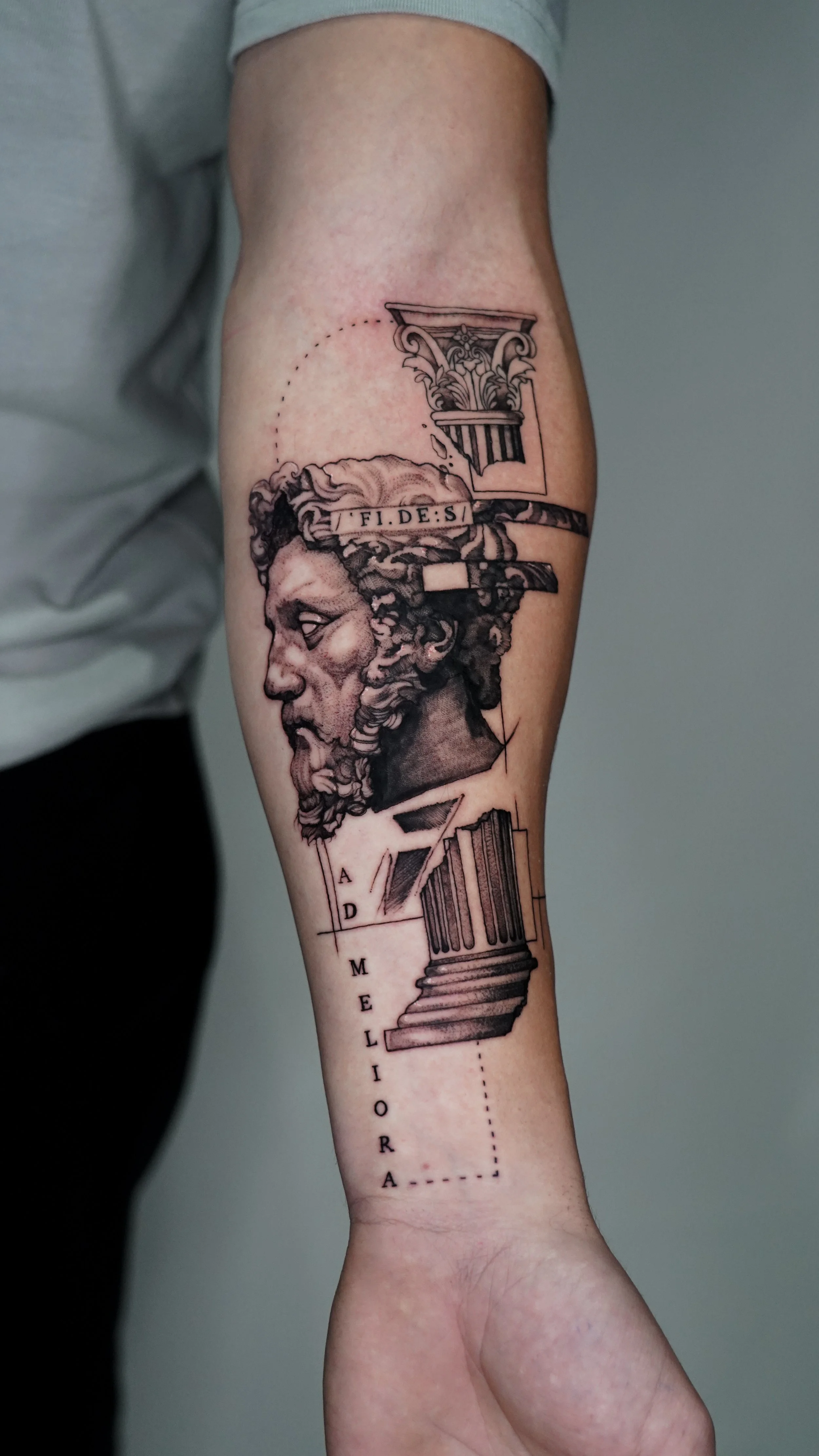 Black and grey tattoo of classical Roman bust Marcus Aurelius with architectural elements and Latin text by Jay C Tattoo, tattoo artist in Brighton and Hove, UK
