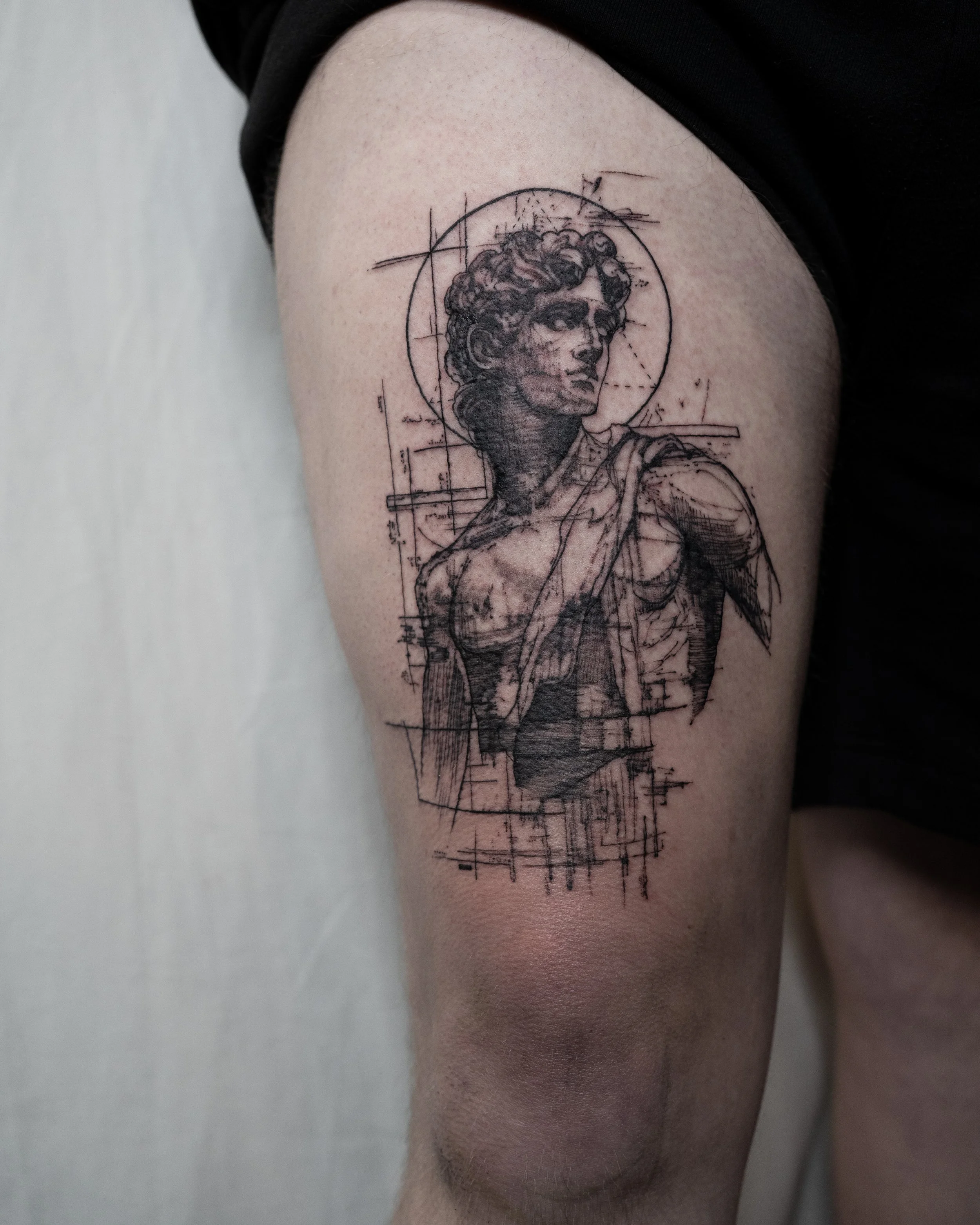 Fine line tattoo of a classical female sculpture with sketch lines and geometric outlines by Jay C Tattoo, Brighton and Hove tattoo artist, UK
